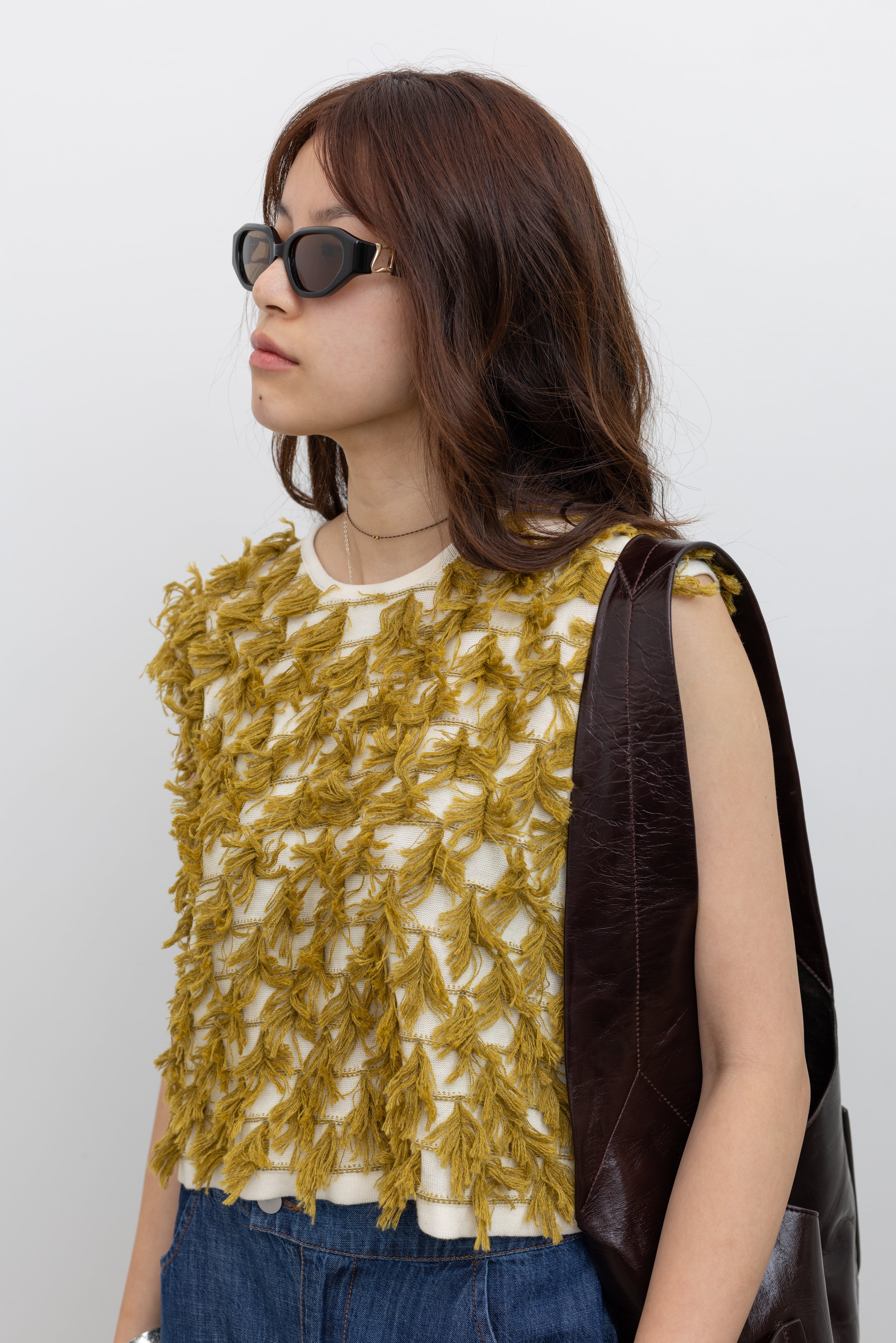 Rachel Comey textured sleeveless top in pima cotton and baby alpaca blend with dimensional fringe trim at Alas Eius.