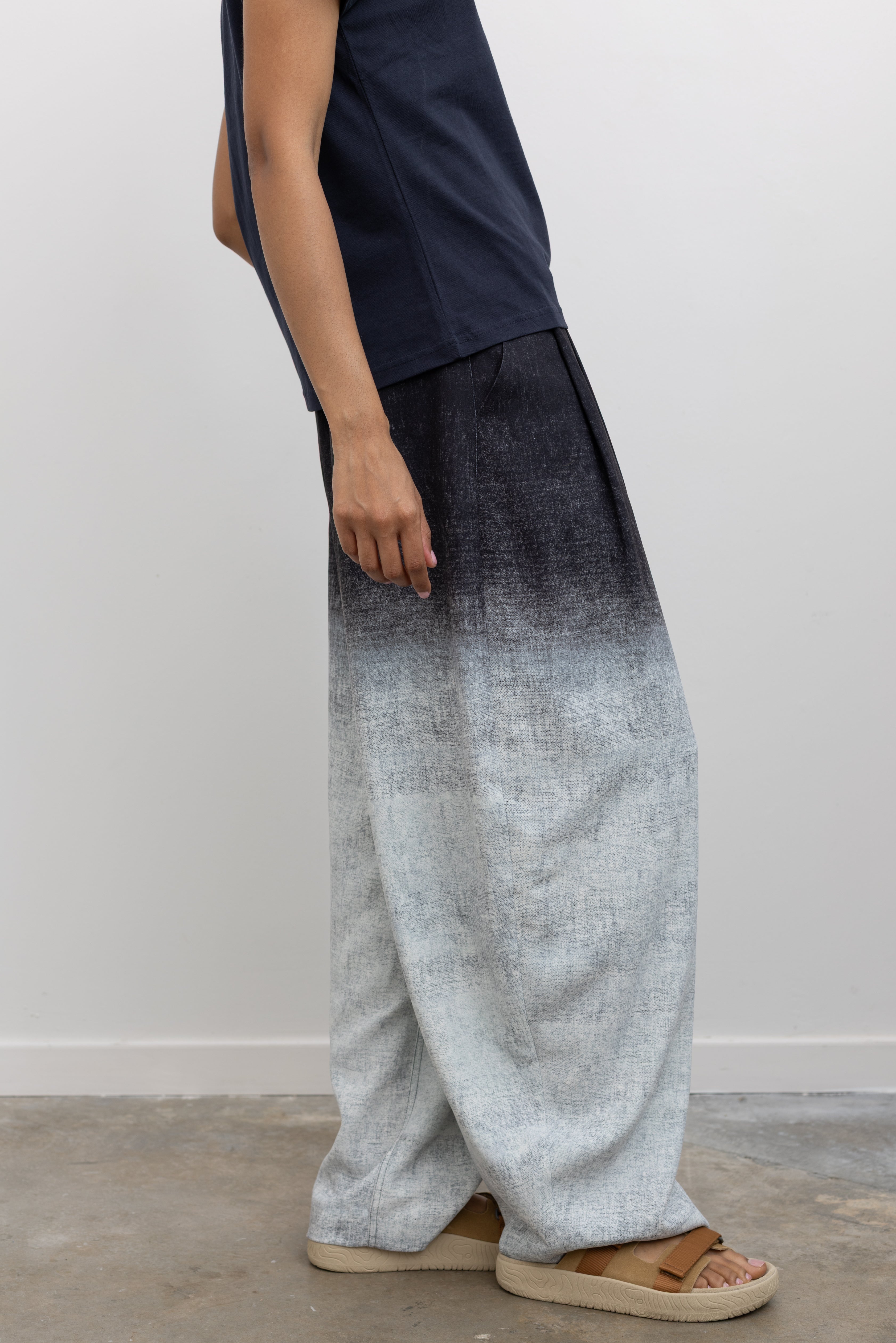 Rachel Comey SS26 Minimal tailored wide-leg trousers with front pleats, belt loops, and functional pocket design at Alas Eius