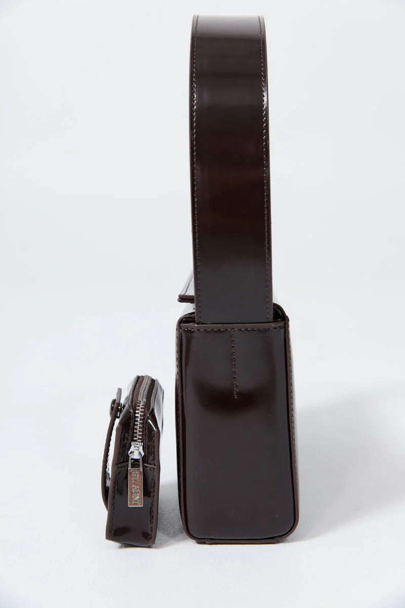 Side view of the minimalist design St. Agni Coffee Brown Leather Petit Pouch Shoulder Bag with removeable zip pouch at Alas Eius 