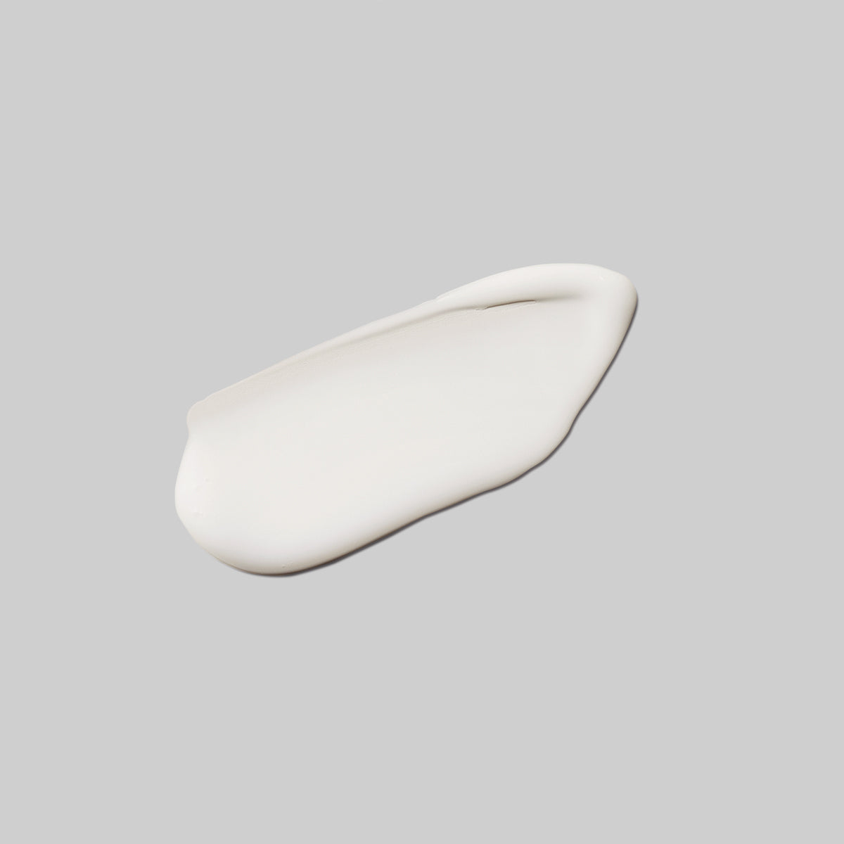 Detailed serum view showing consistency of This Moment hand cream from the non-toxic skincare line called Sugeregg. The hand cream is Paraben-free; phthalate-free; sulfate-free; silicone-free; fragrance-free; oil-free.