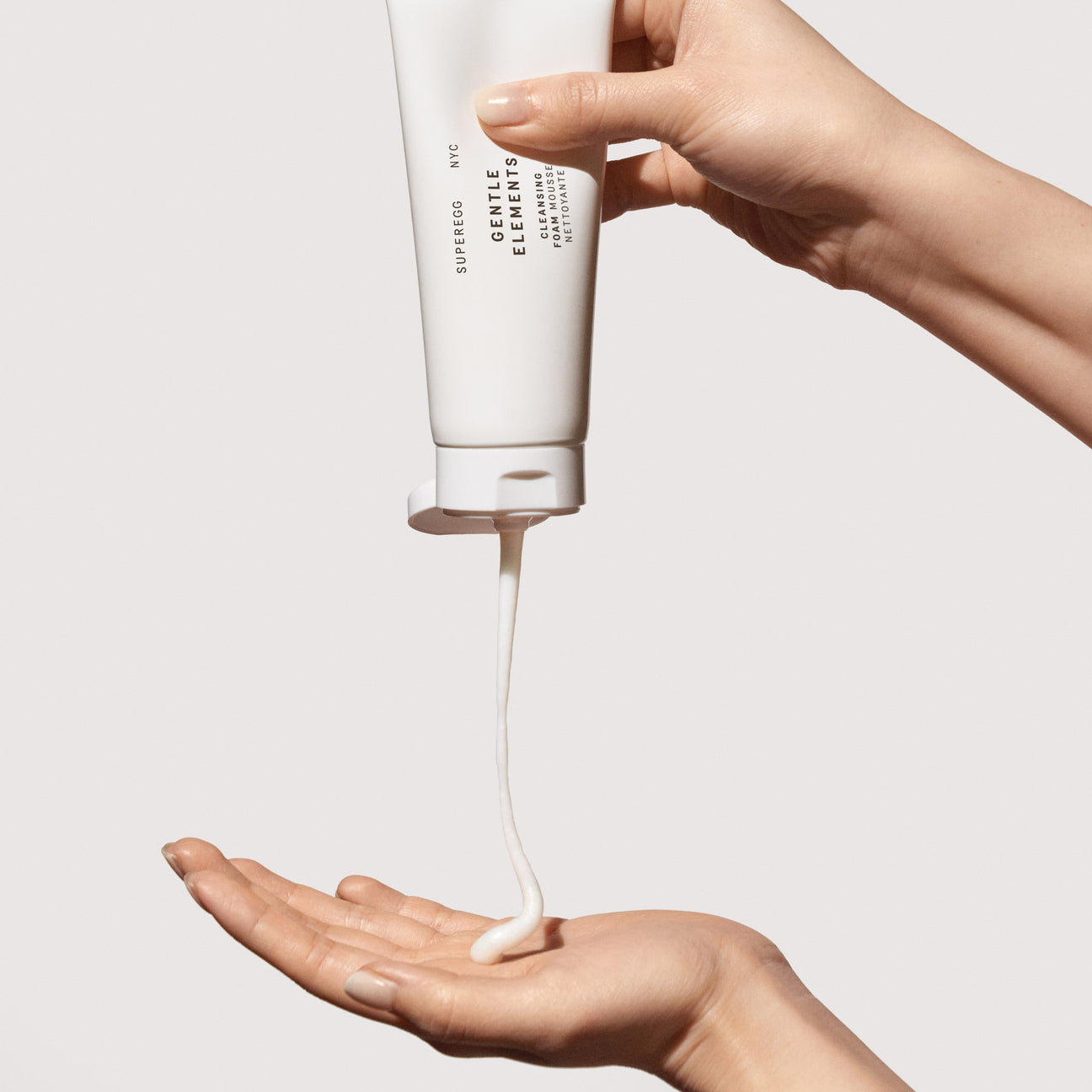 Woman dispensing non-toxic and anti-aging Superegg Gentle Elements Foaming Cream Cleanser
that is enriched with botanical extracts and antioxidants at Alas Eius