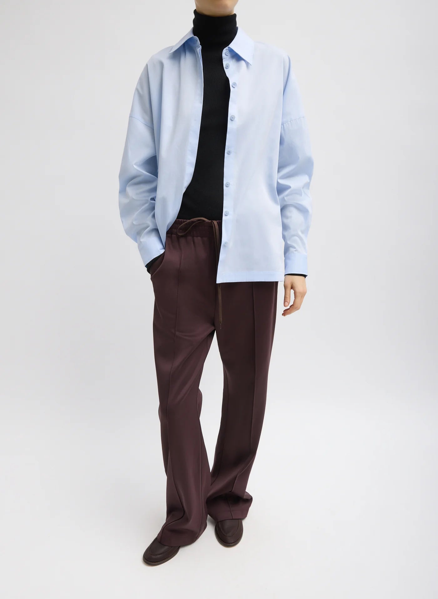Woman styling Tibi's active scottie jogger and cotton shirt at alas eius