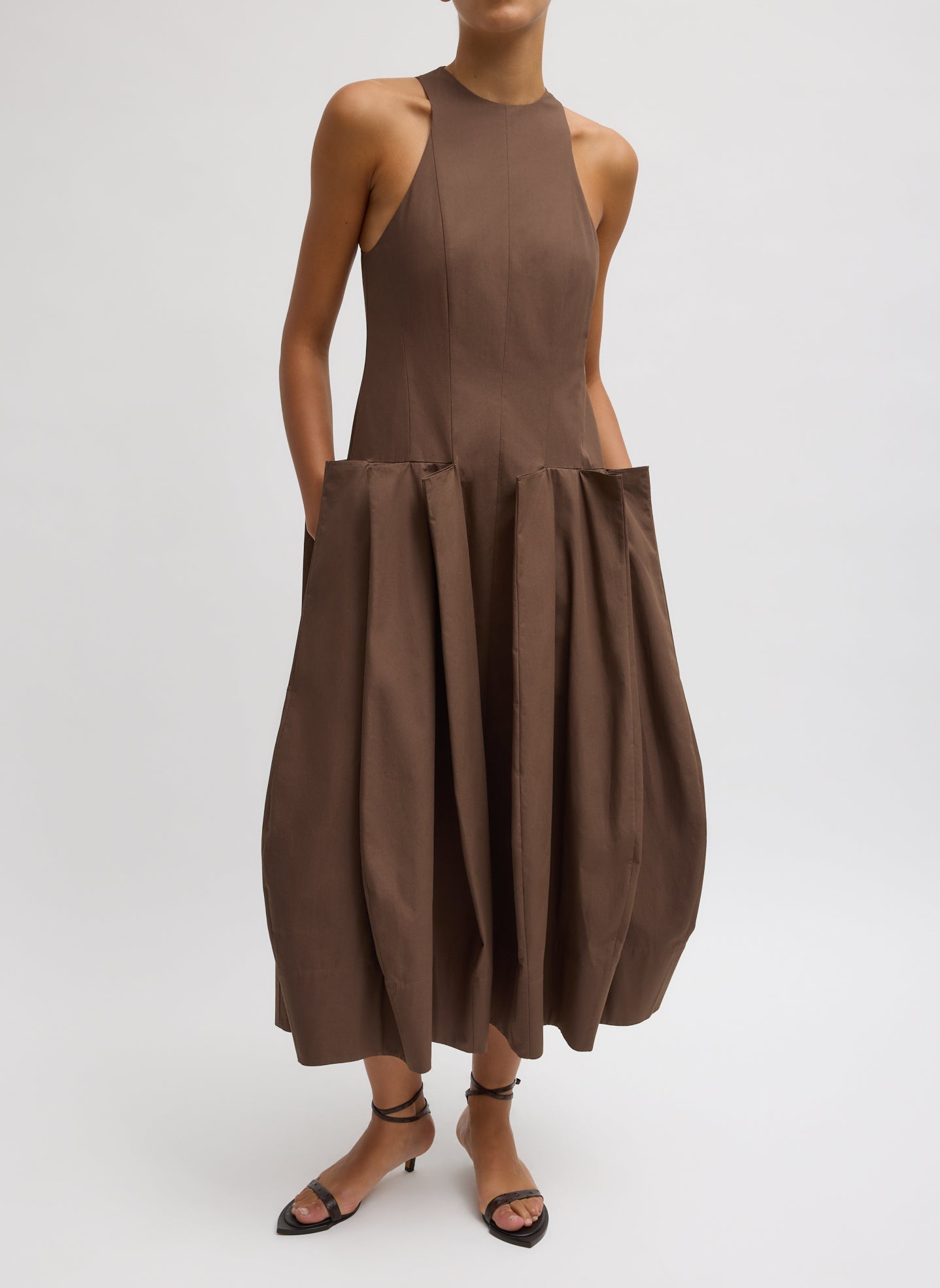 Woman wearing Spring fashion in a Tibi Brown Compact Eco Poplin Pinched Pleat Dress at Alas Eius