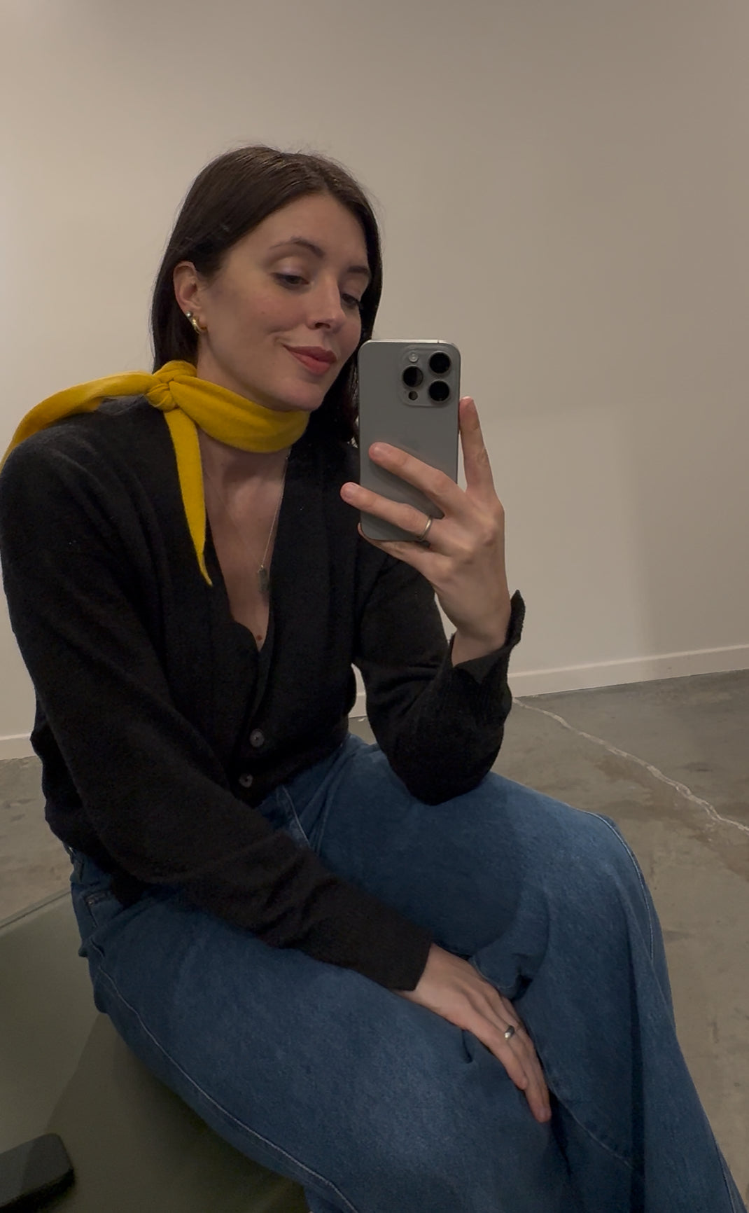 Fall fashion outfit inspiration with a yellow gold cashmere scarf tied around her neck at Alas Eius 