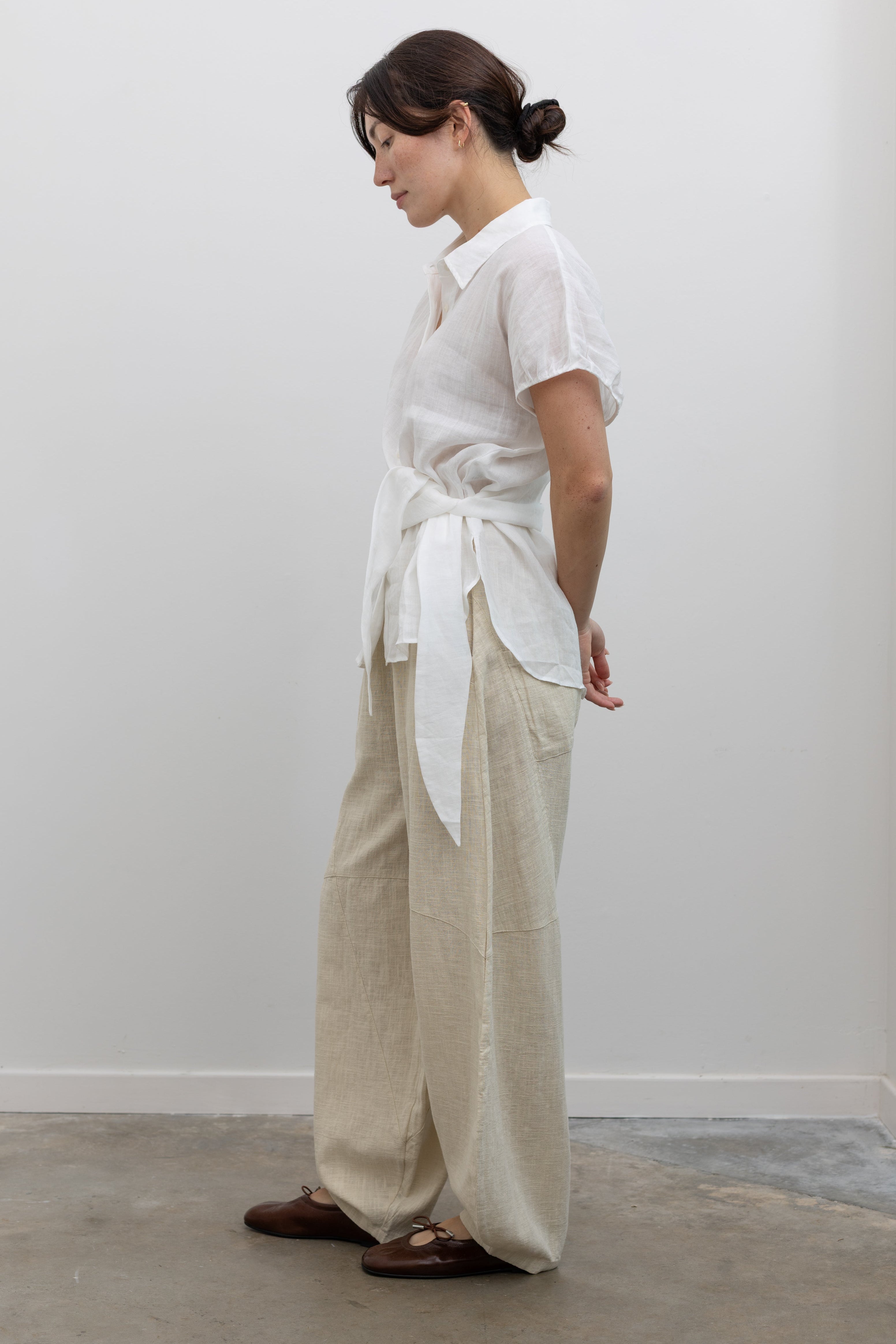 Collective minimalist cap sleeve tunic top with feminine side ties at Alas Eius