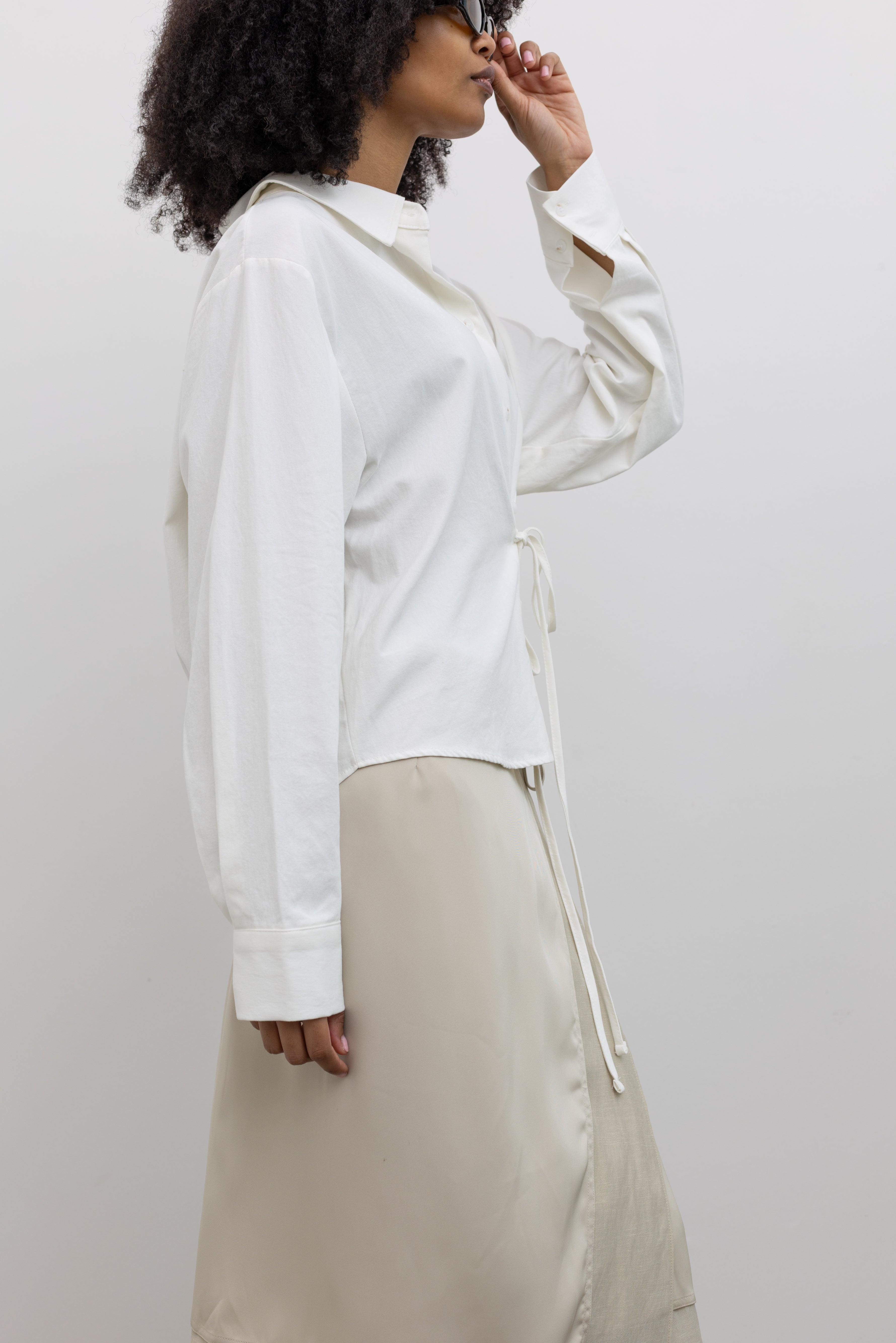 Alas Eius Cotton Side Tie Button Down Top with an Adjustable Waist Tie and Modern Sculptural Silhouette at Alas Eius