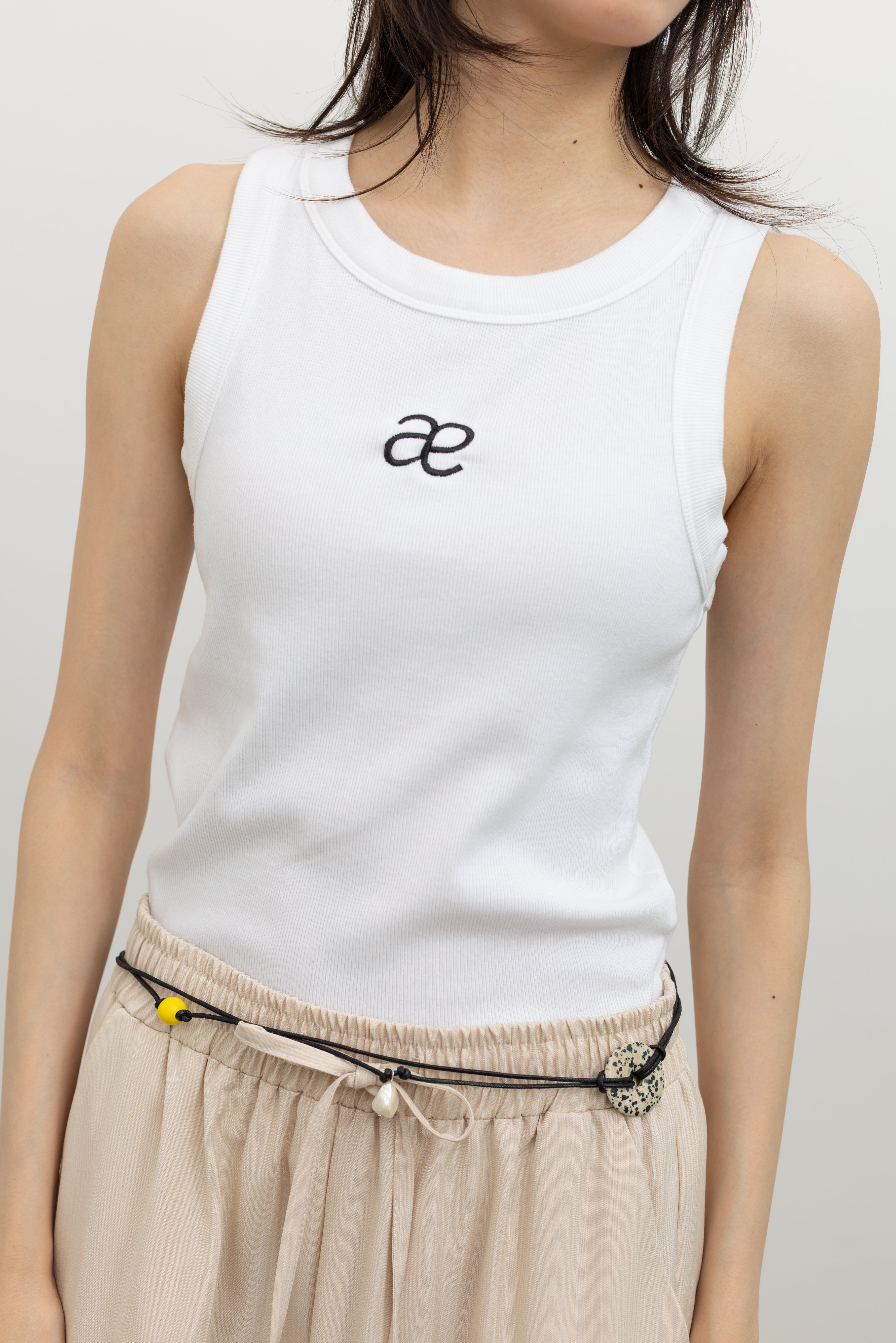 Alas Eius lightweight ribbed tank featuring AE embroidery, designed for effortless women's casual everyday fashion styling at Alas Eius