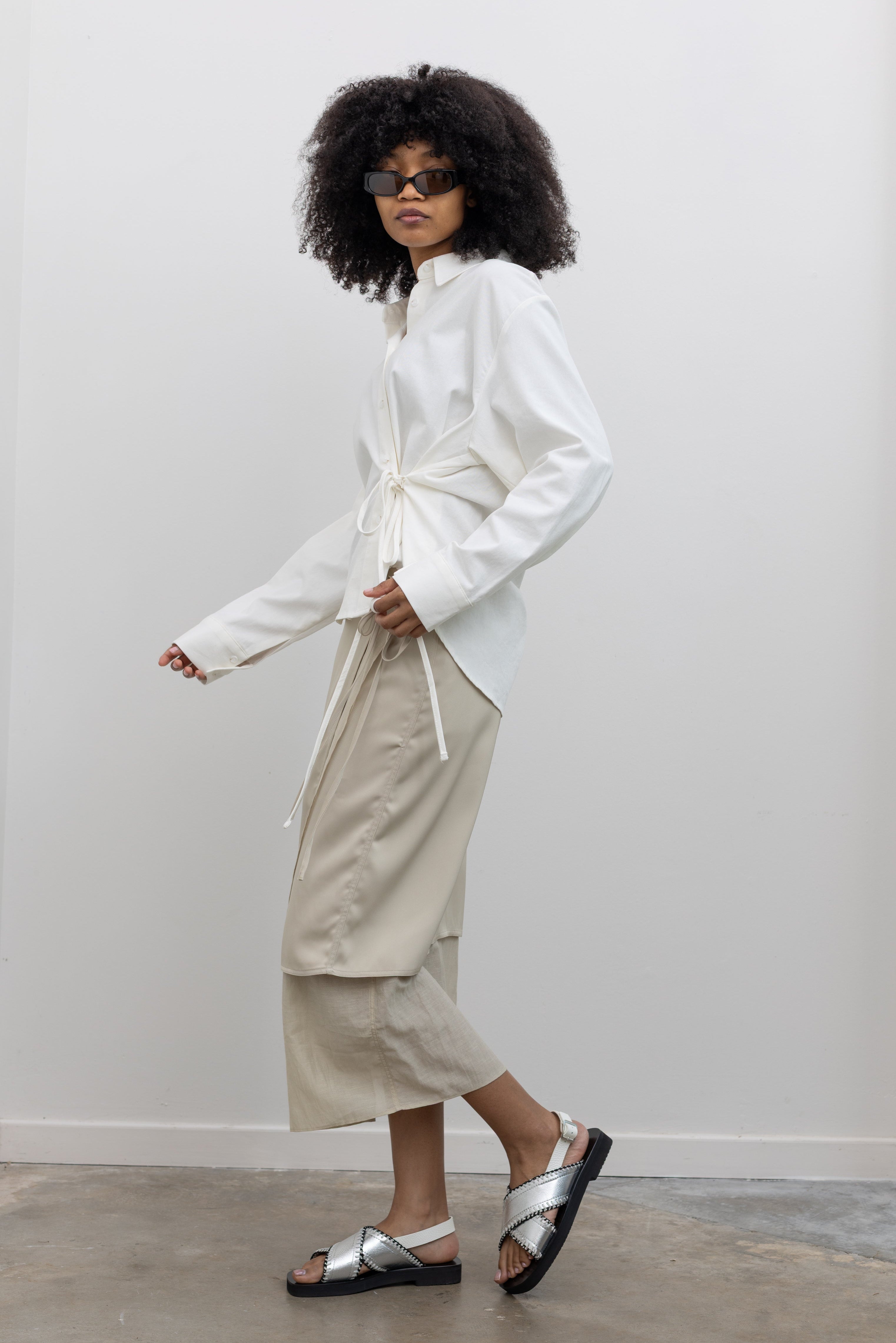 Alas Eius Minimalist Beige Satin Midi Skirt with Wrap Front and Tie Waist at Alas Eius