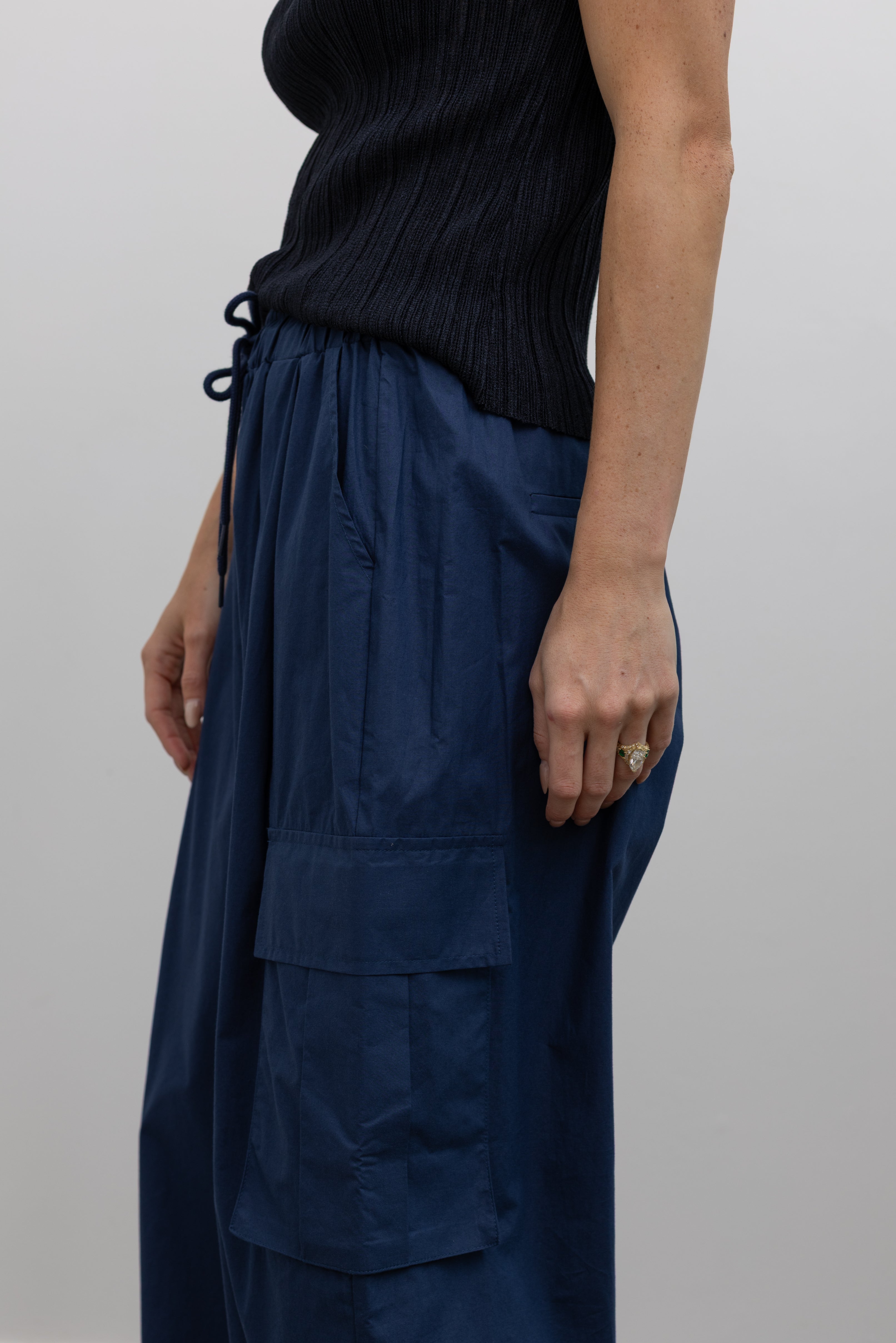 Alas Eius relaxed cotton wide-leg cargo pants with adjustable drawstring waist and utility pockets at Alas Eius