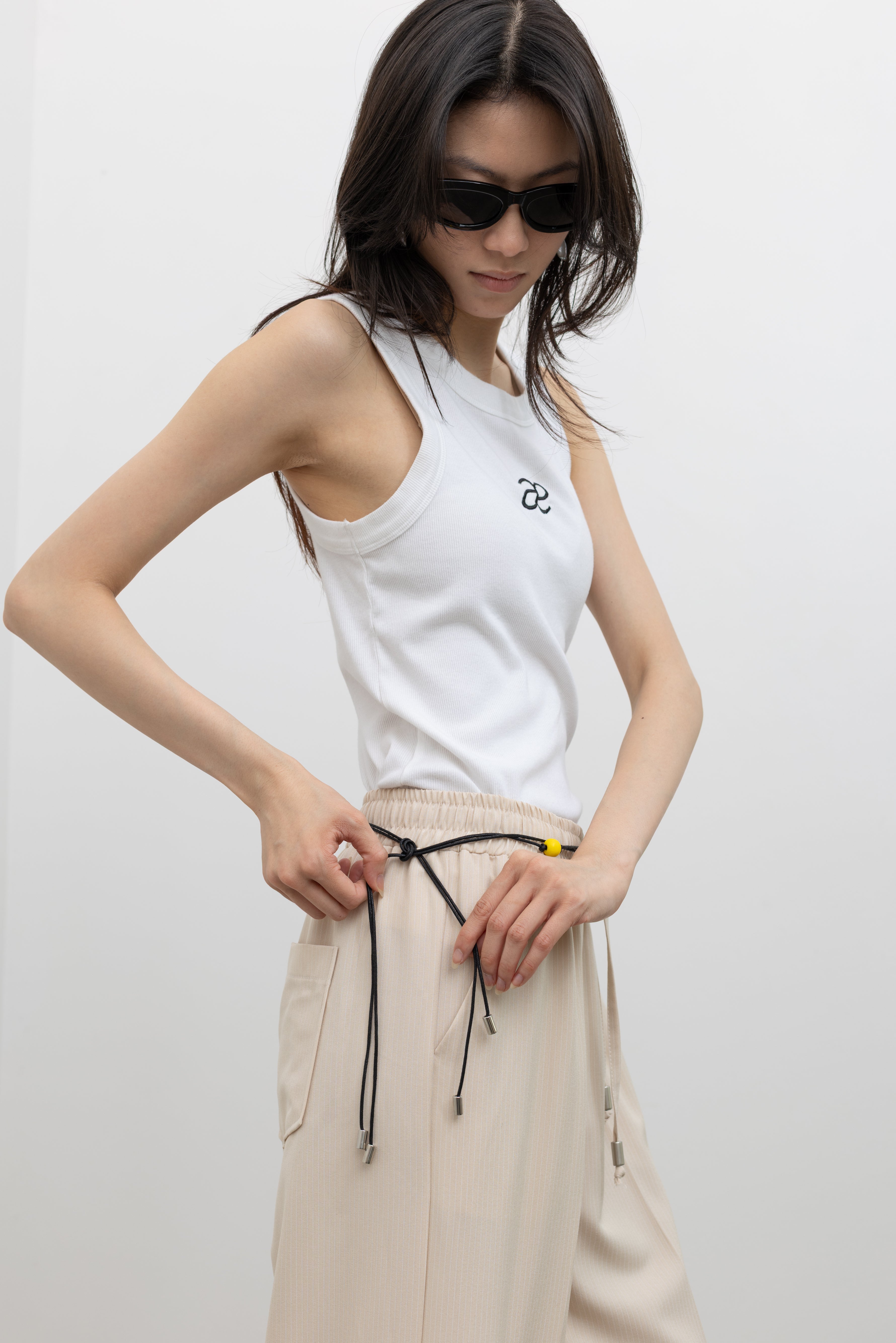 Alas Eius classic ribbed sleeveless tank top crafted in cotton blend, perfect for women's capsule wardrobe layering pieces at Alas Eius