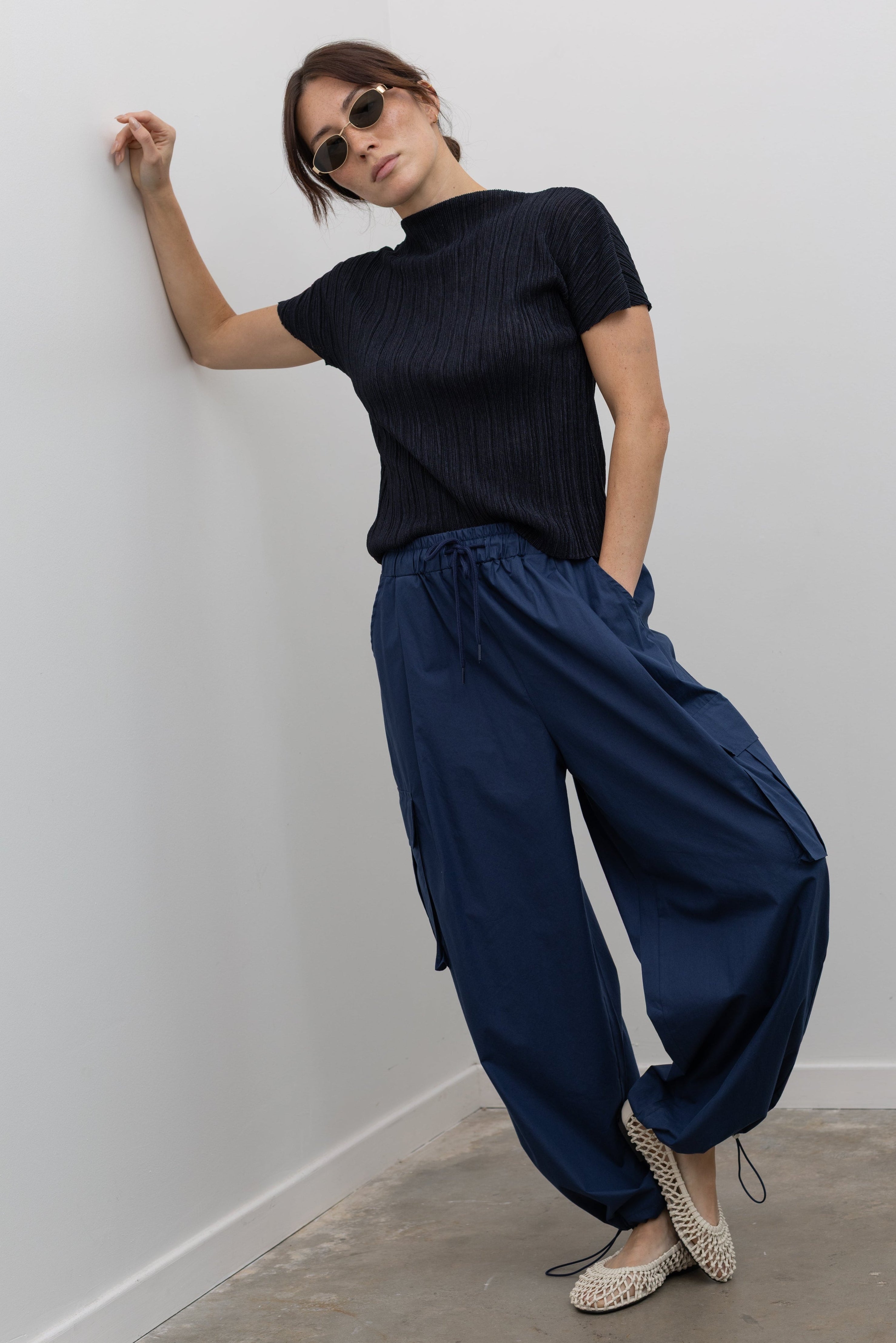 Alas Eius lightweight cotton wide-leg cargo pants with adjustable ankle bungee cords and drawstring waist at Alas Eius