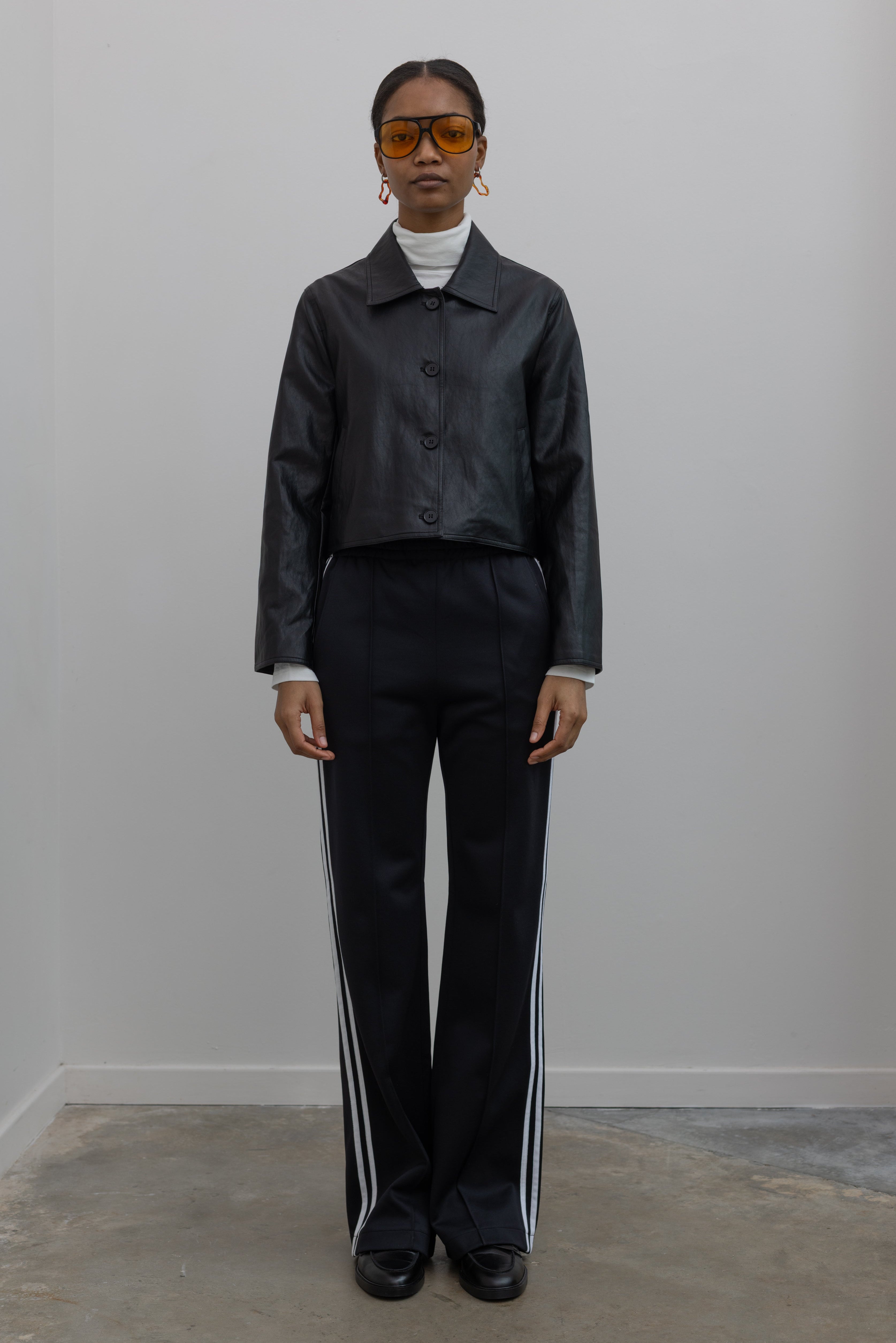 tibi track pants styled with alas eius vegan leather jacket