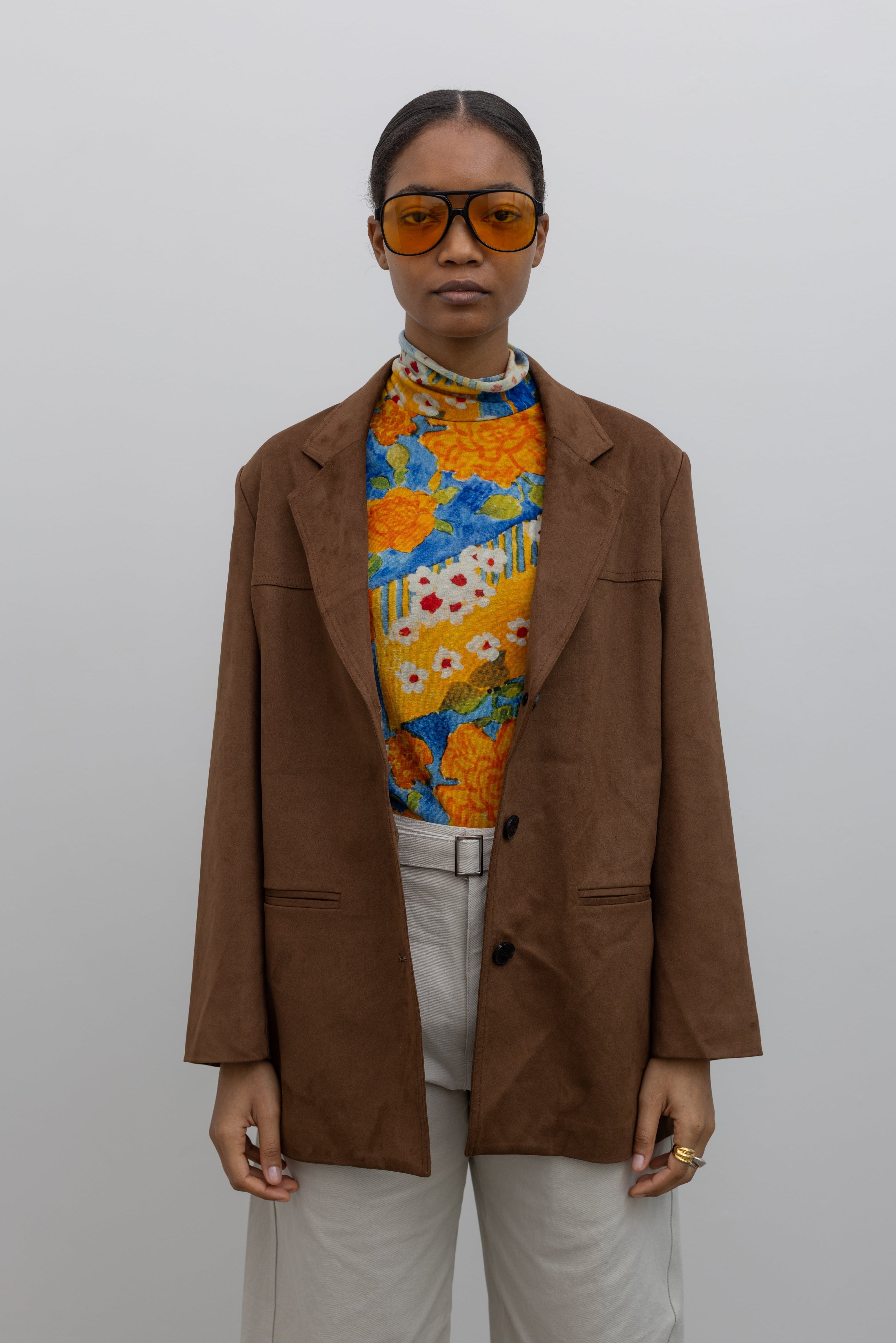 fall fashion in a brown suede blazer with floral turtleneck at alas eius
