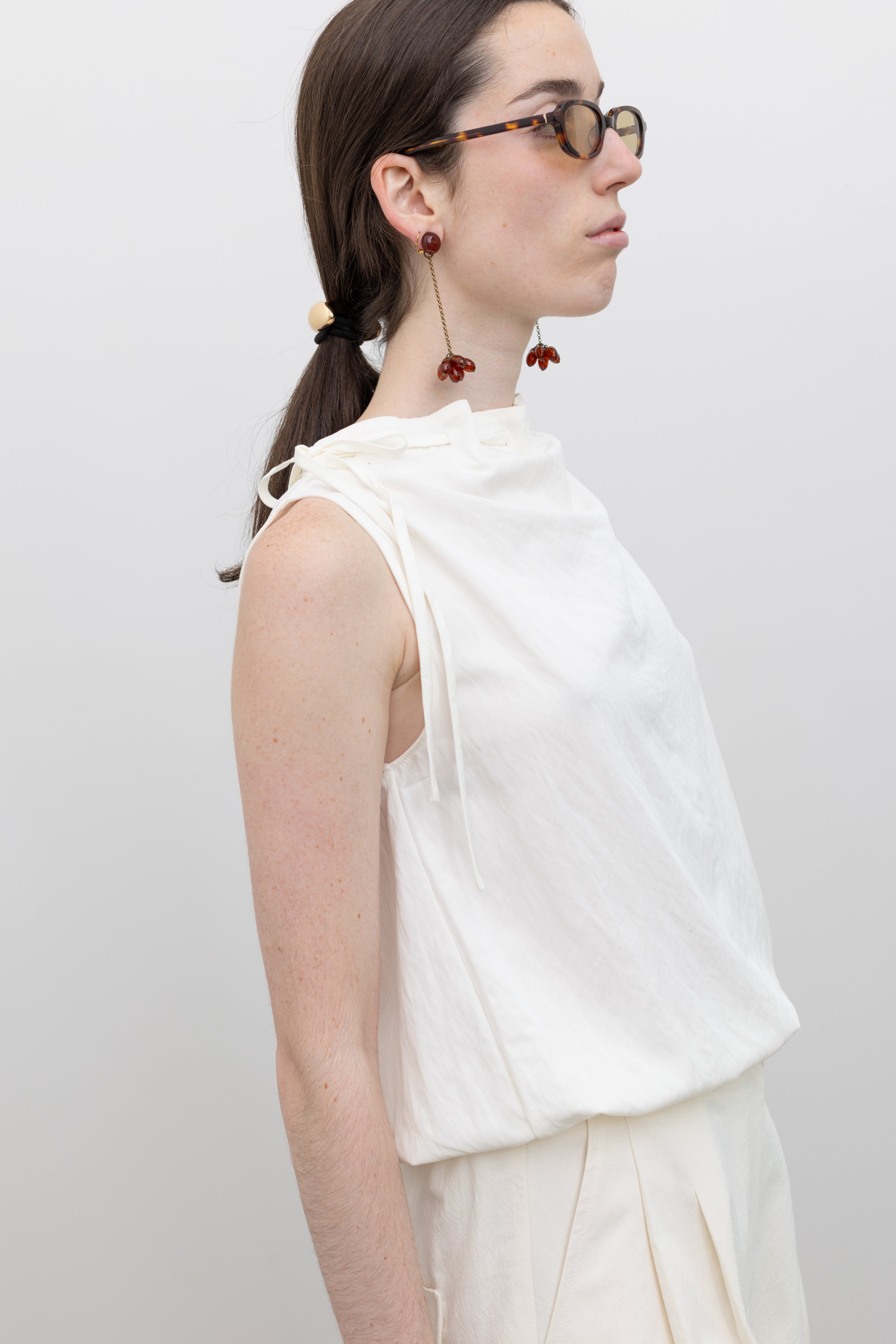 Collective adjustable tie neck sleeveless blouse featuring bubble hem detailing and effortless women's contemporary wardrobe styling at Alas Eius