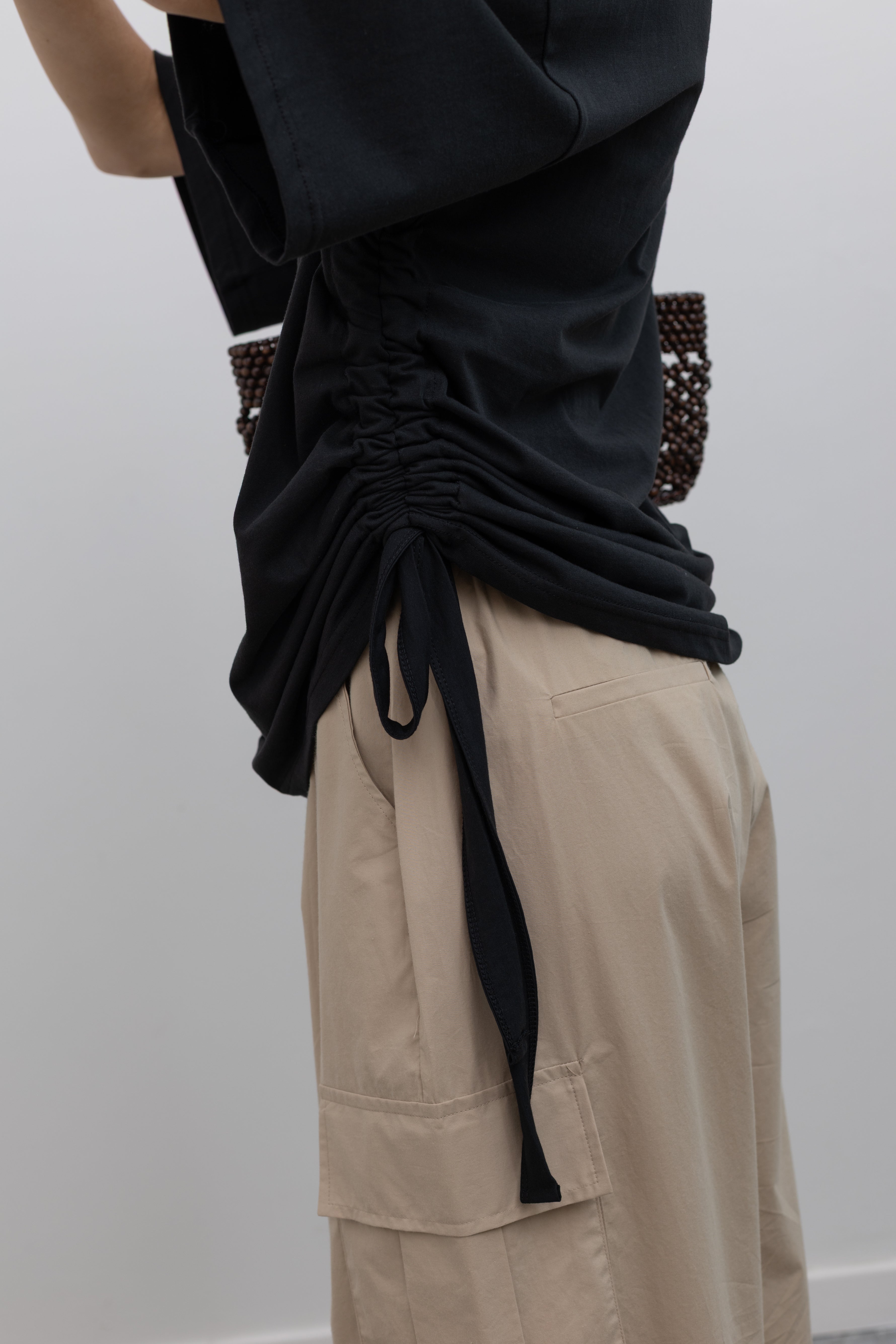 Collective modern cotton crewneck tee with architectural side ruching at Alas Eius
