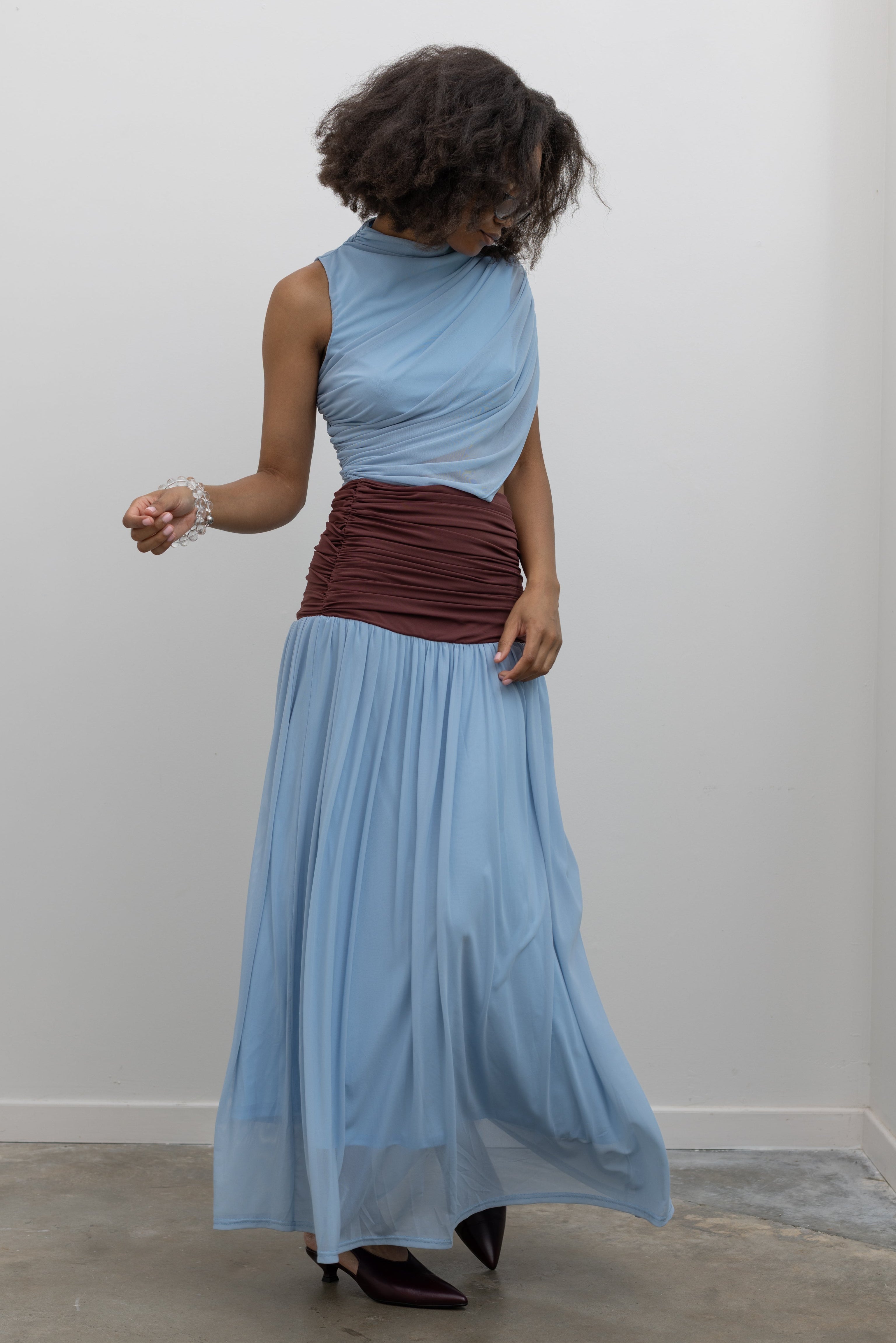 Collective asymmetric maxi dress featuring a powder-blue bodice and chocolate ruched waist at Alas Eius