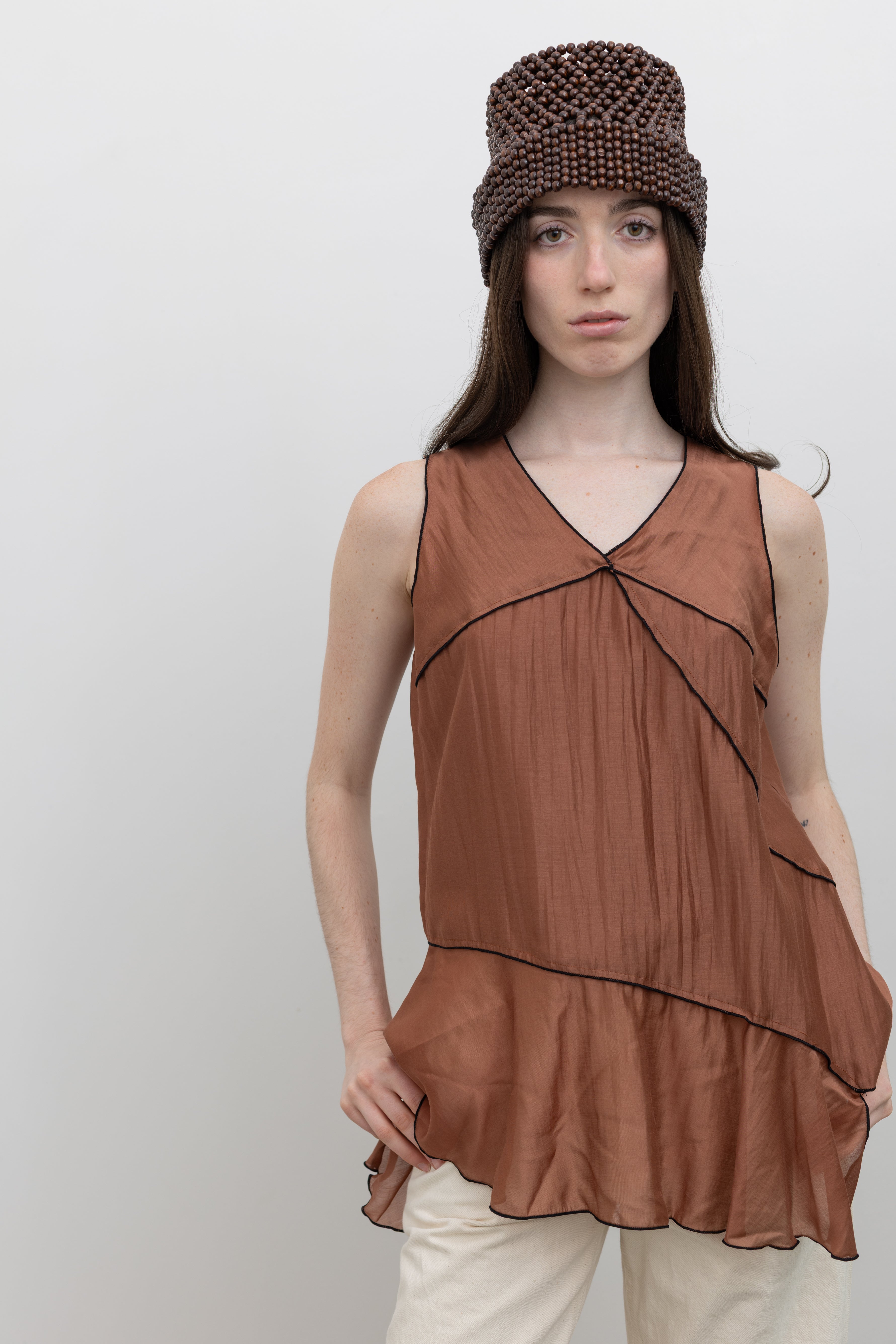 Collective asymmetrical hem top featuring contrast stitching and effortless women's minimalist clothing style at Alas Eius