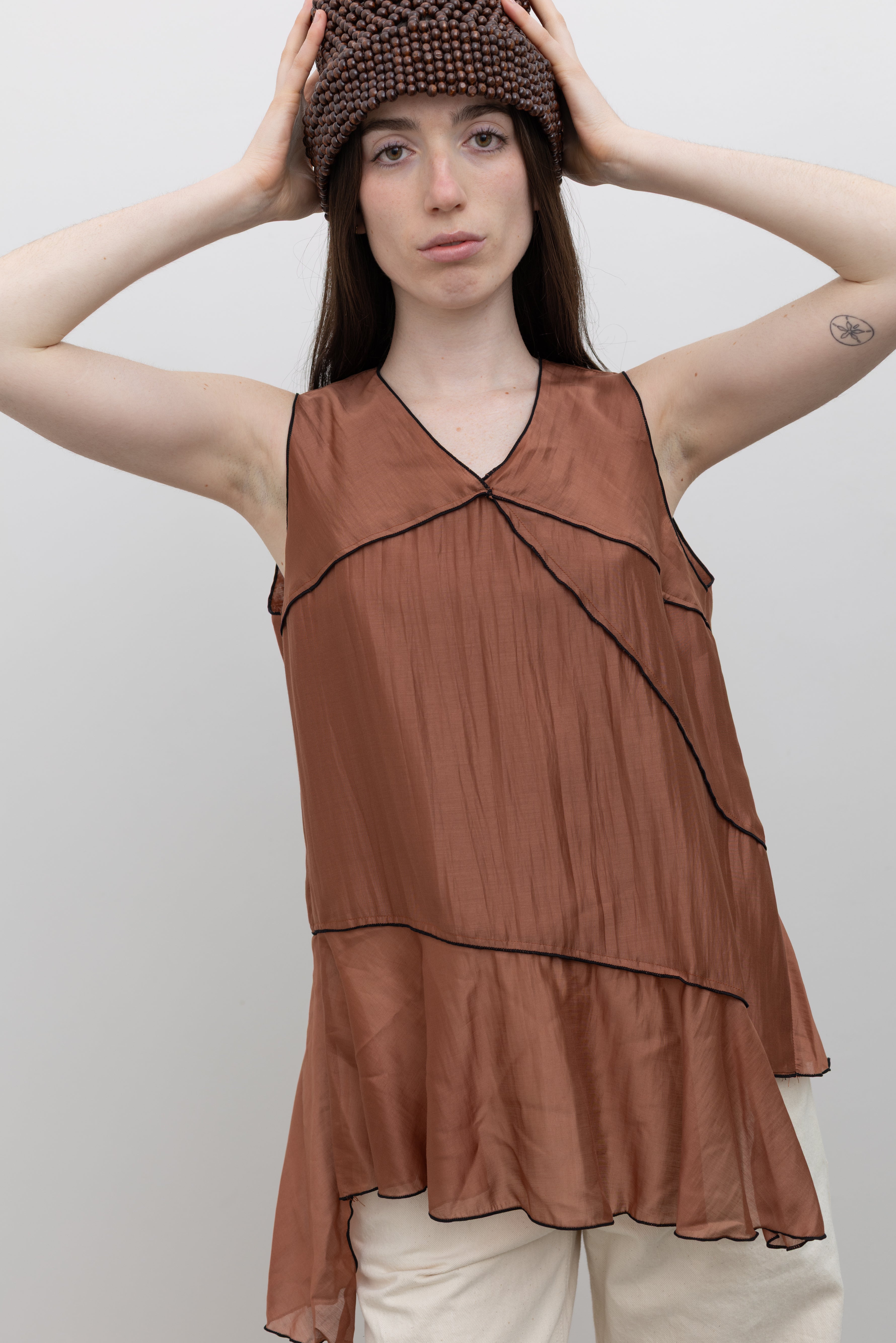 Collective asymmetrical sleeveless top with contrast stitching and fluid drape for sophisticated women's luxury fashion at Alas Eius