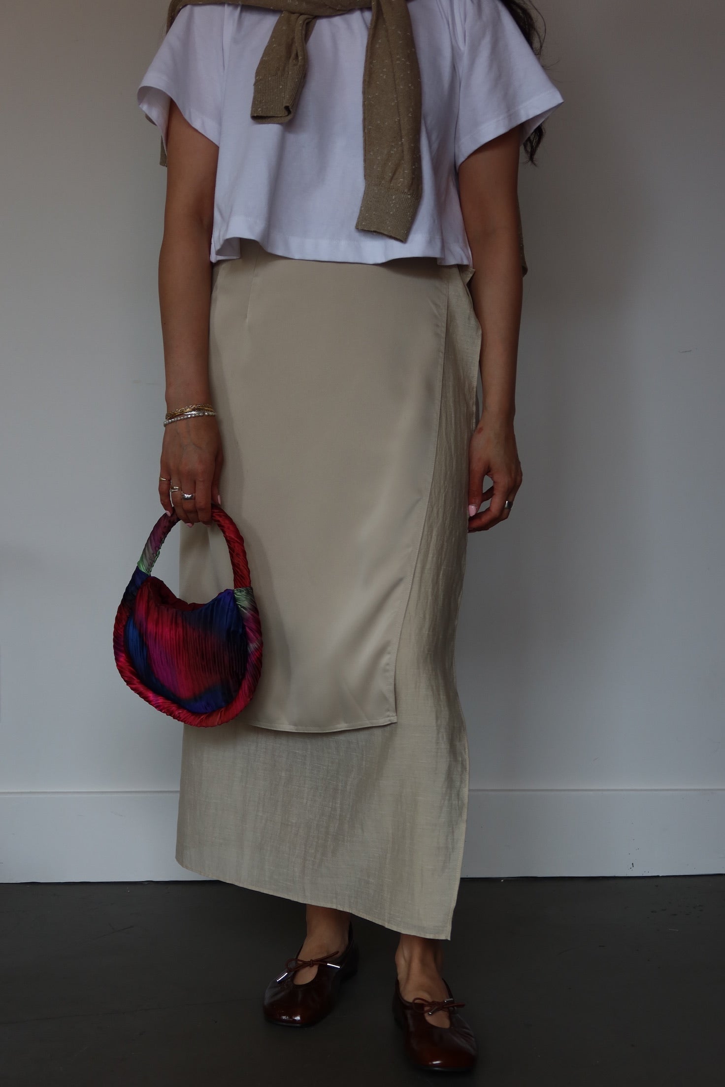 Collective beige satin midi wrap skirt with exposed lining and fluid drape, refined contemporary womenswear at Alas Eius