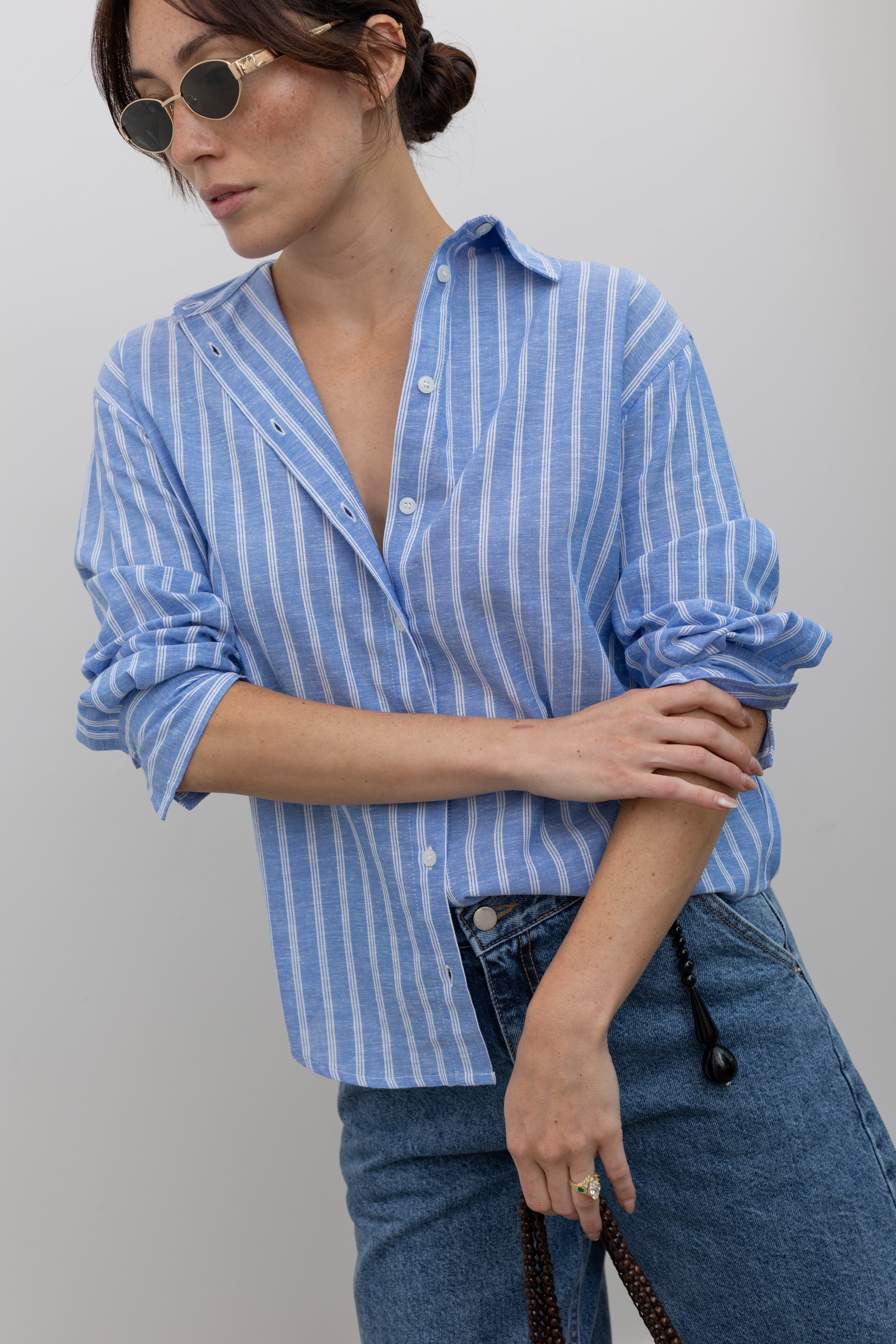 Collective blue striped cotton-linen button-down shirt styled with a relaxed silhouette at Alas Eius