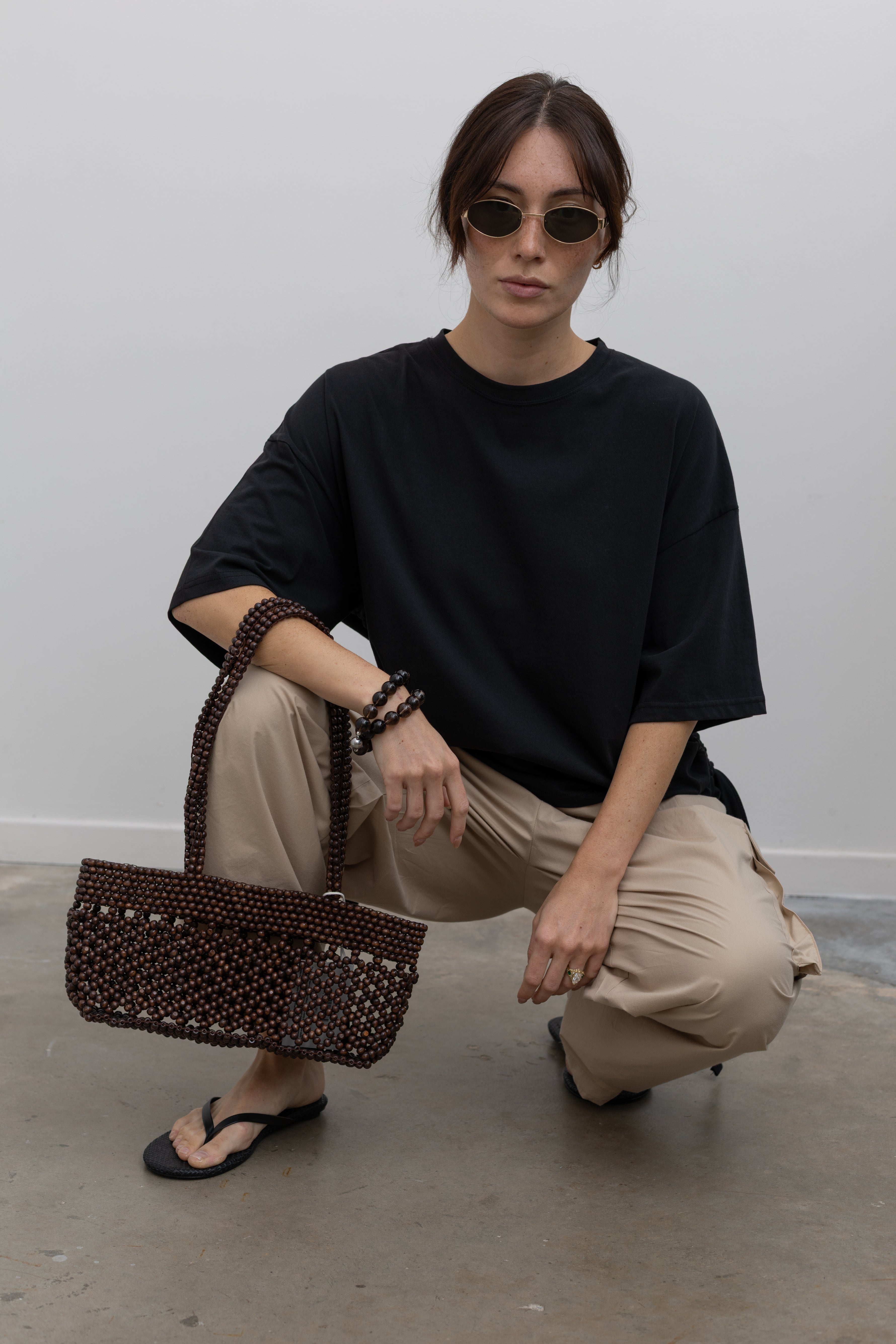 Collective cotton boxy tee with functional side-tunnel drawstrings and relaxed silhouette at Alas Eius