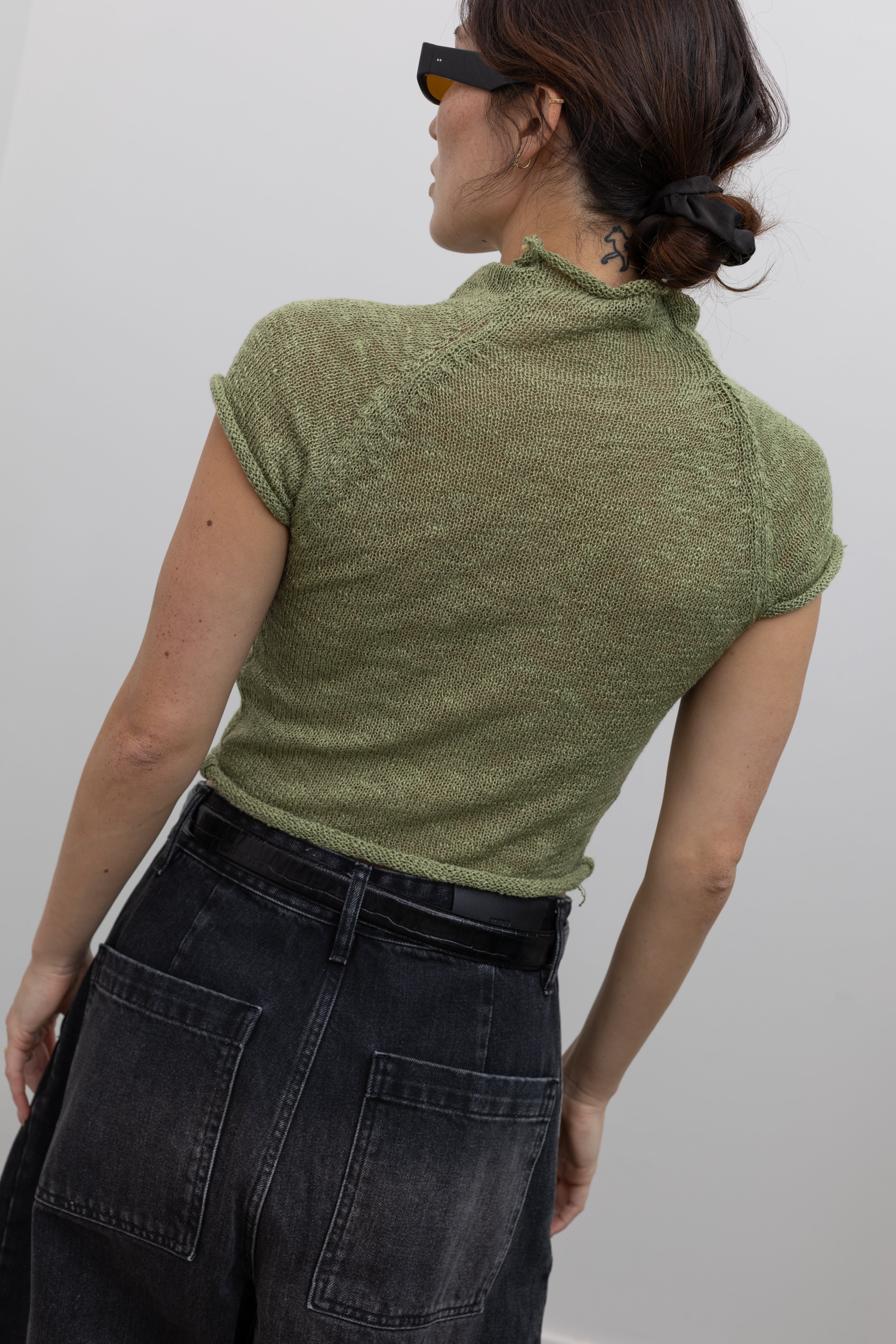 Collective elegant semi-sheer knit top with a fitted silhouette at Alas Eius
