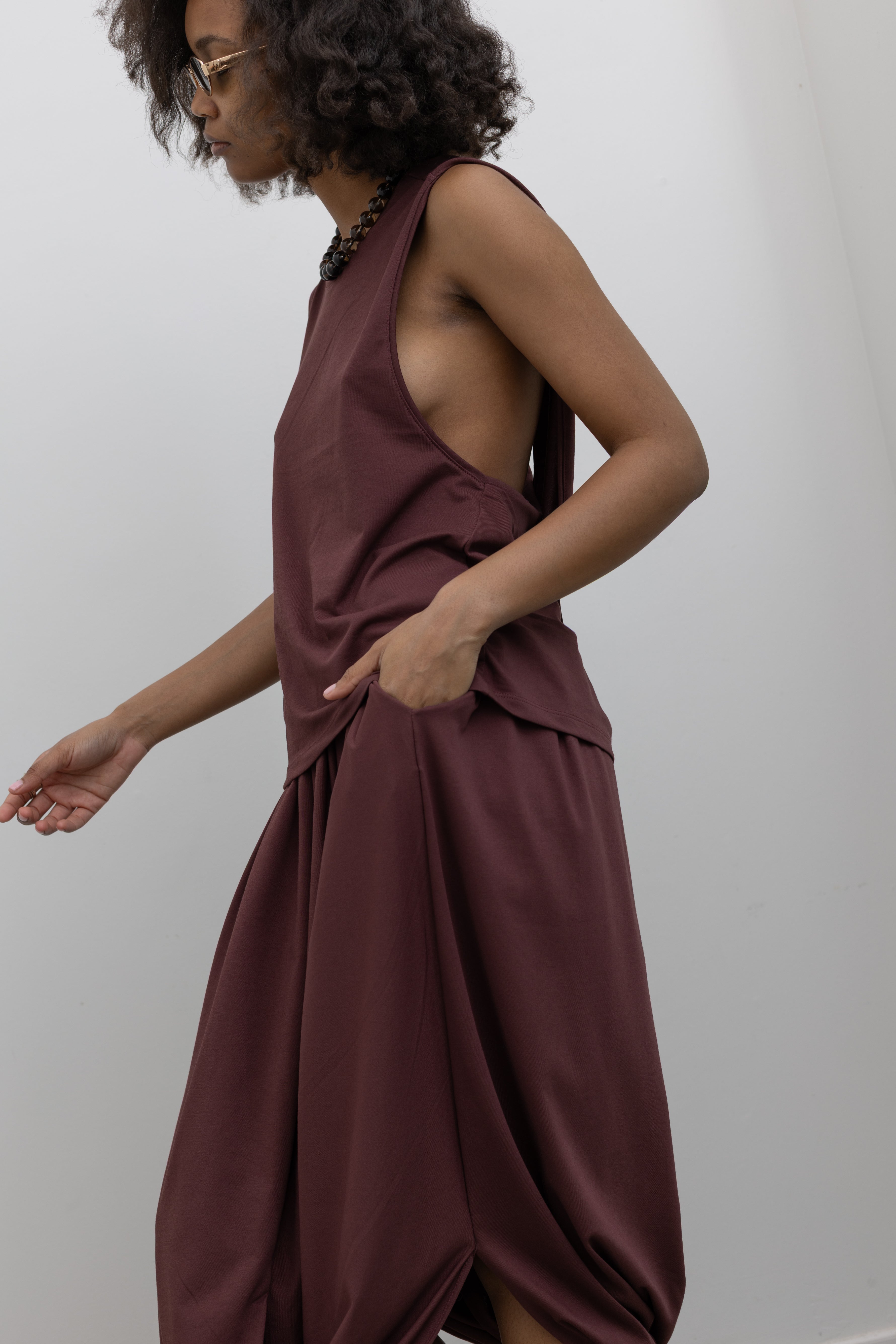 Collective chic cocoon skirt with elastic waistband, side pockets, and fluid movement at Alas Eius