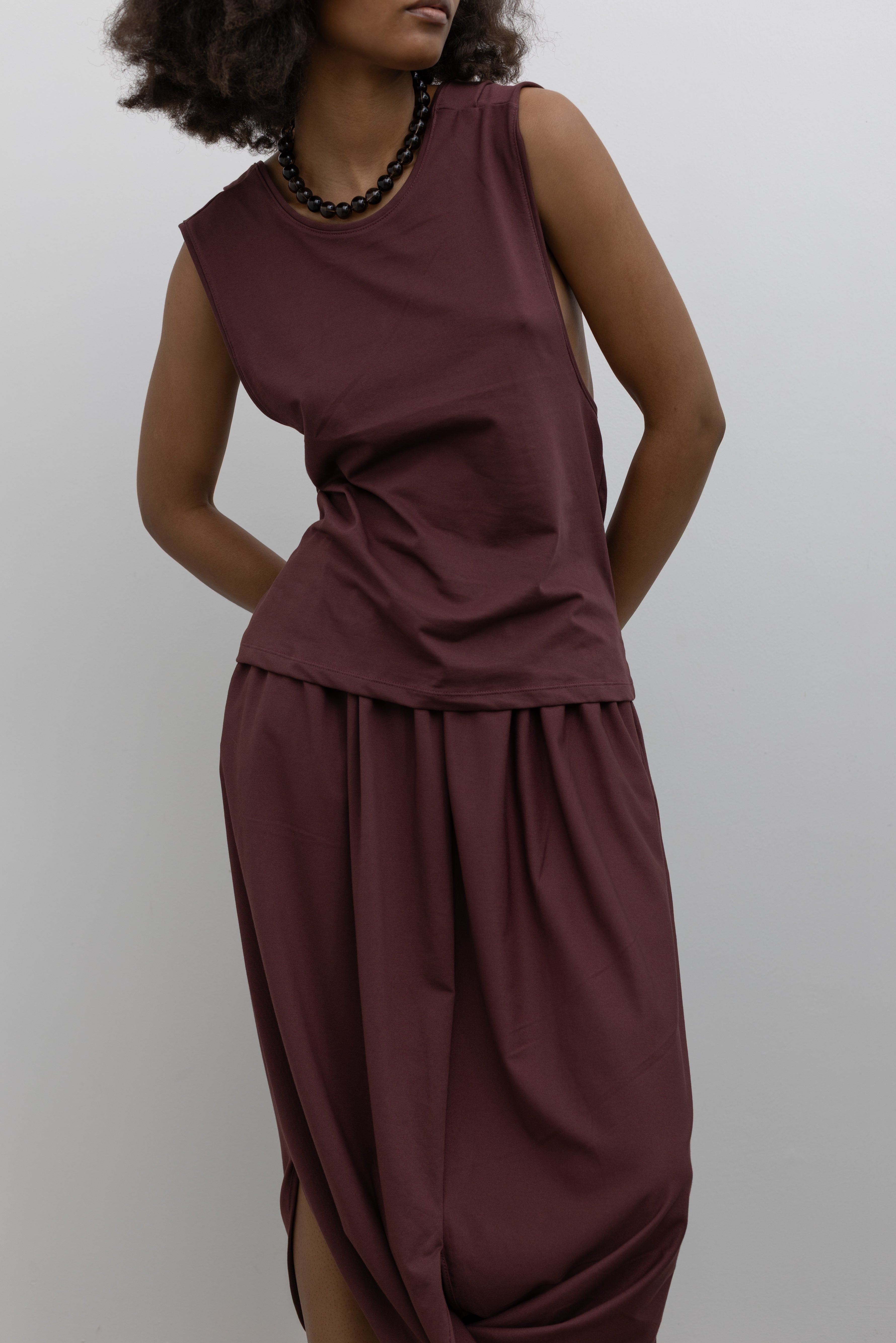 Collective cotton-stretch sleeveless top featuring a fluid draped back detail at Alas Eius