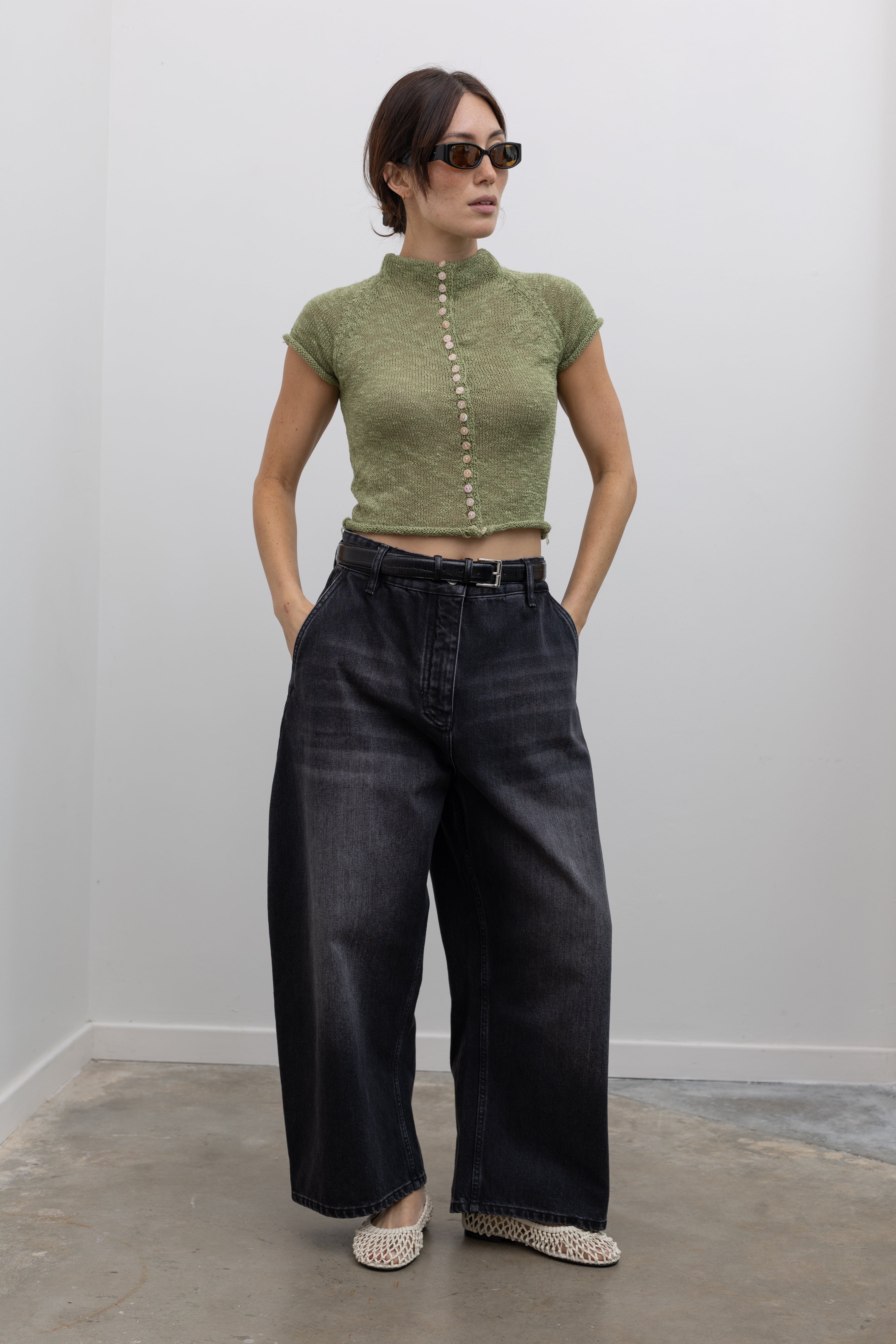 Collective rolled mock neck knit top with decorative button accents at Alas Eius