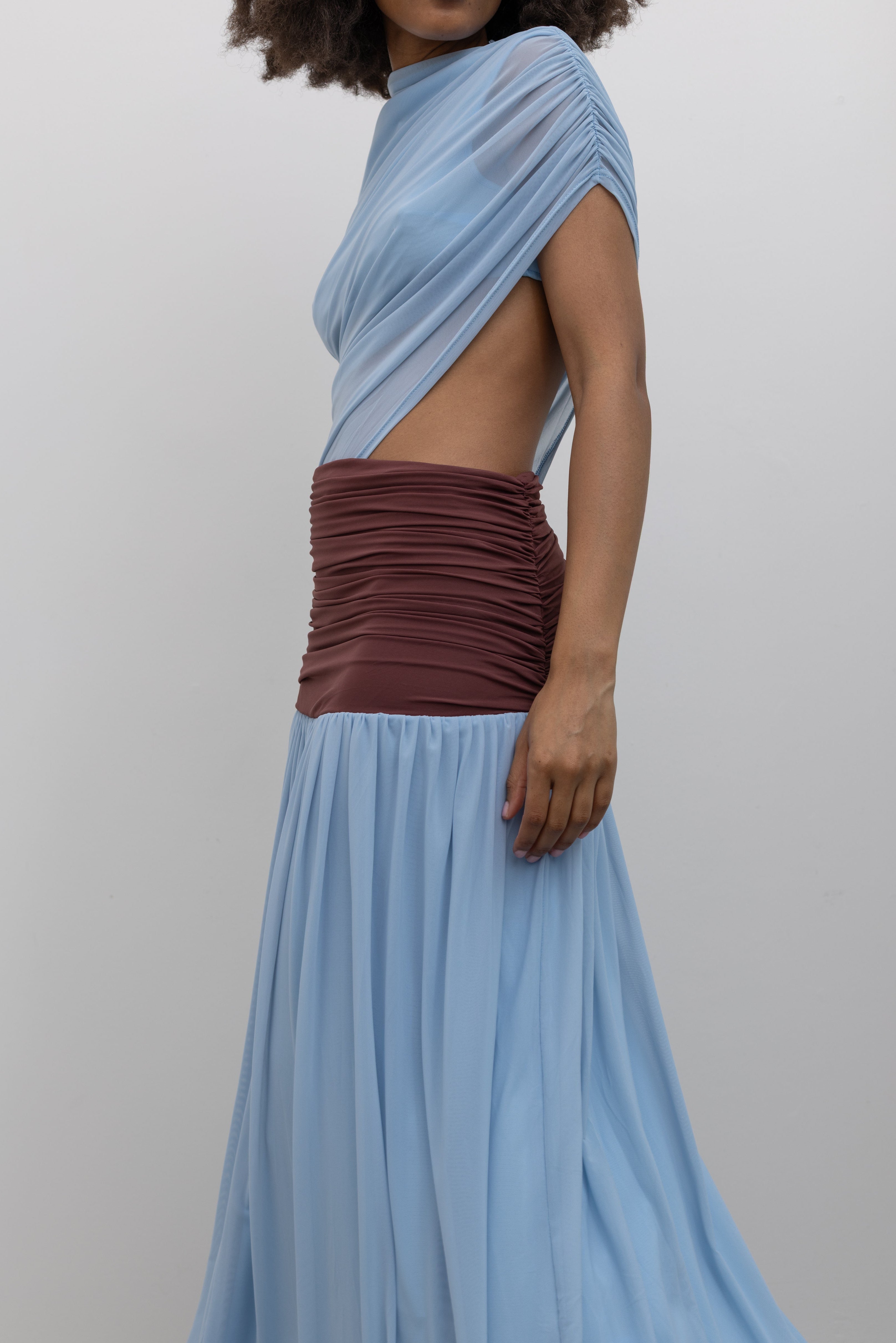 Collective sleeveless stretch-mesh dress with side waist cutout and flowing pleated skirt at Alas Eius