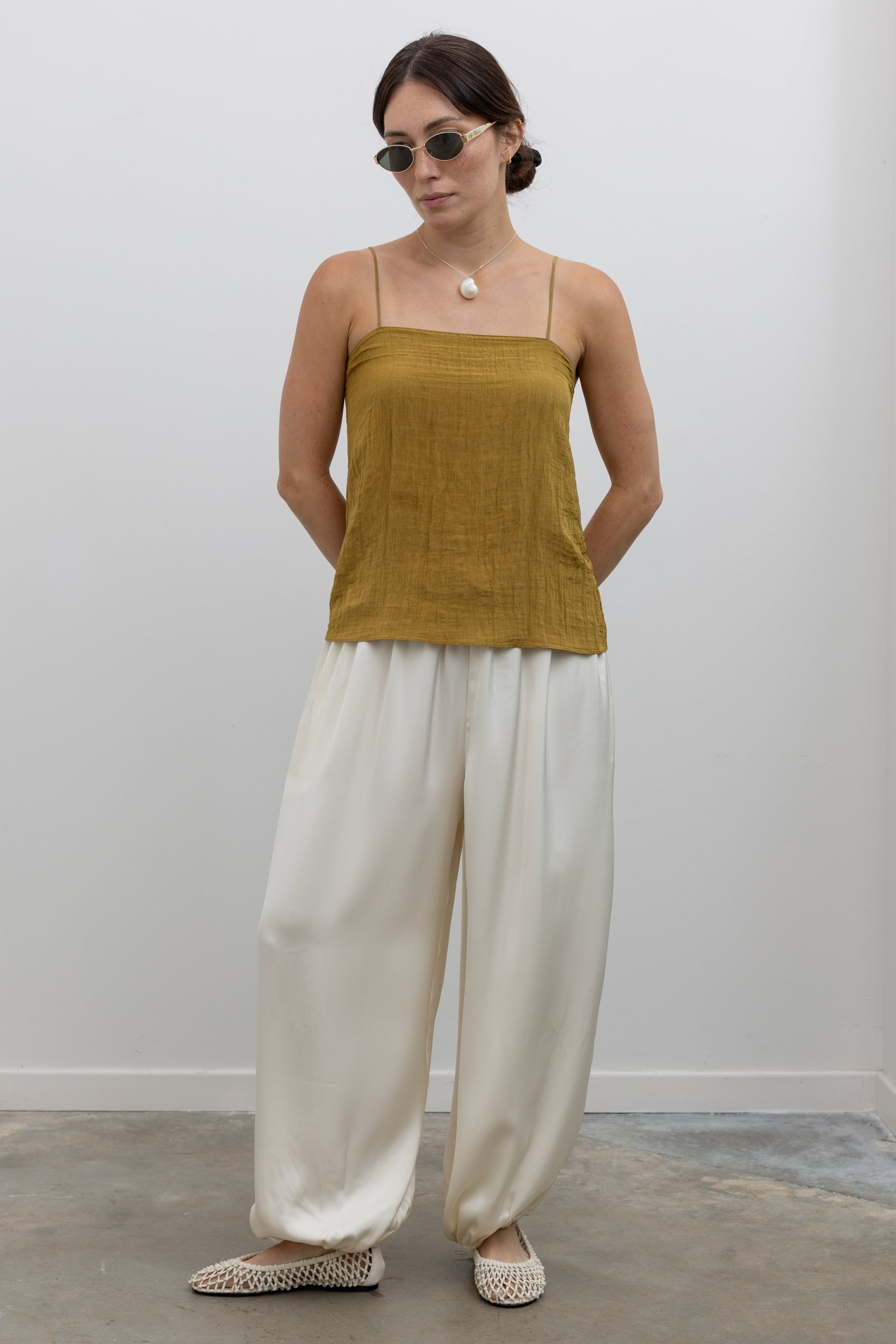 Collective double crepe balloon-leg pants with fluid drape and elastic waistband at Alas Eius