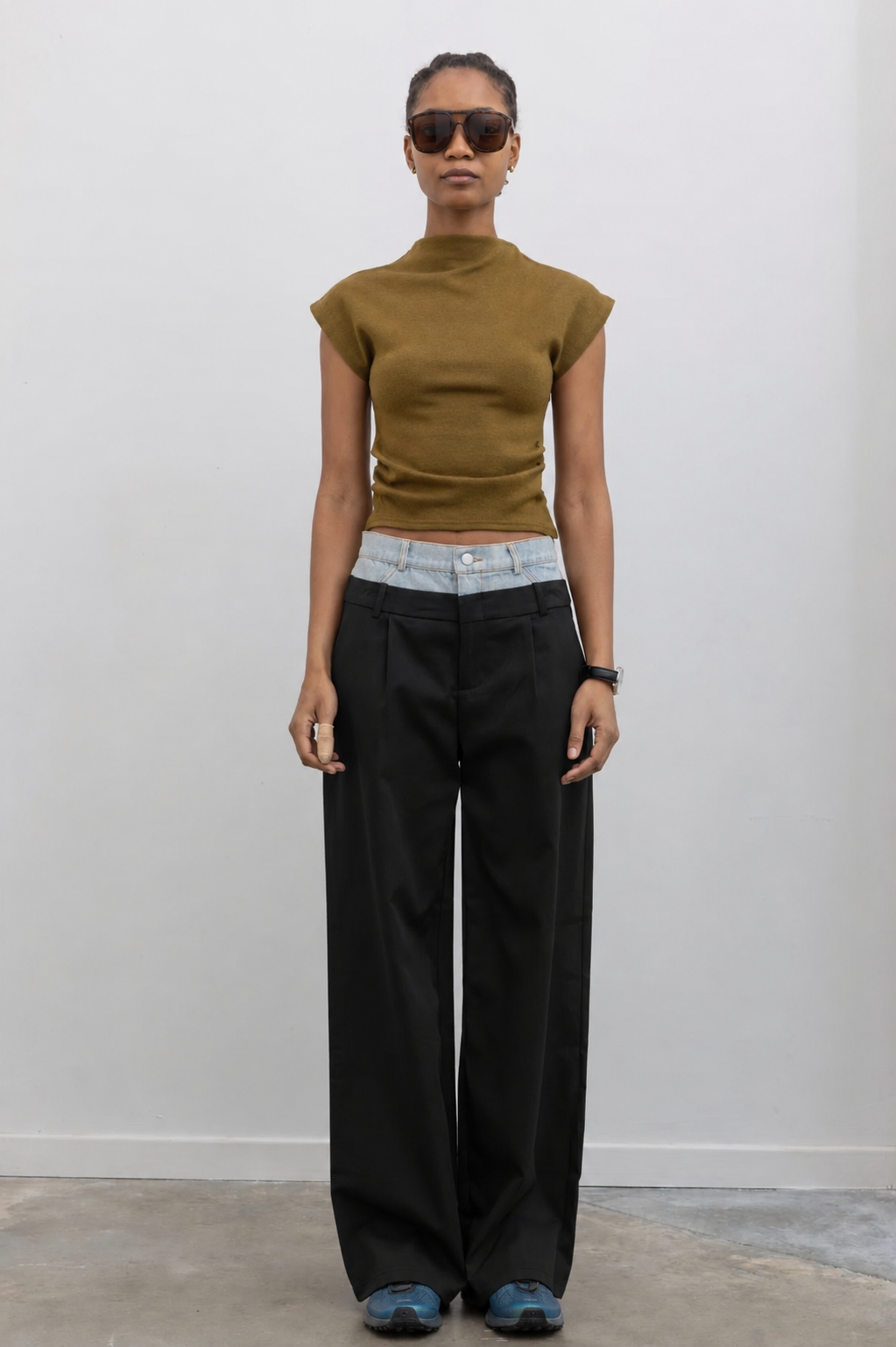 Collective double layer denim and tailored pants styled with a minimalist top for a modern statement outfit at Alas Eius