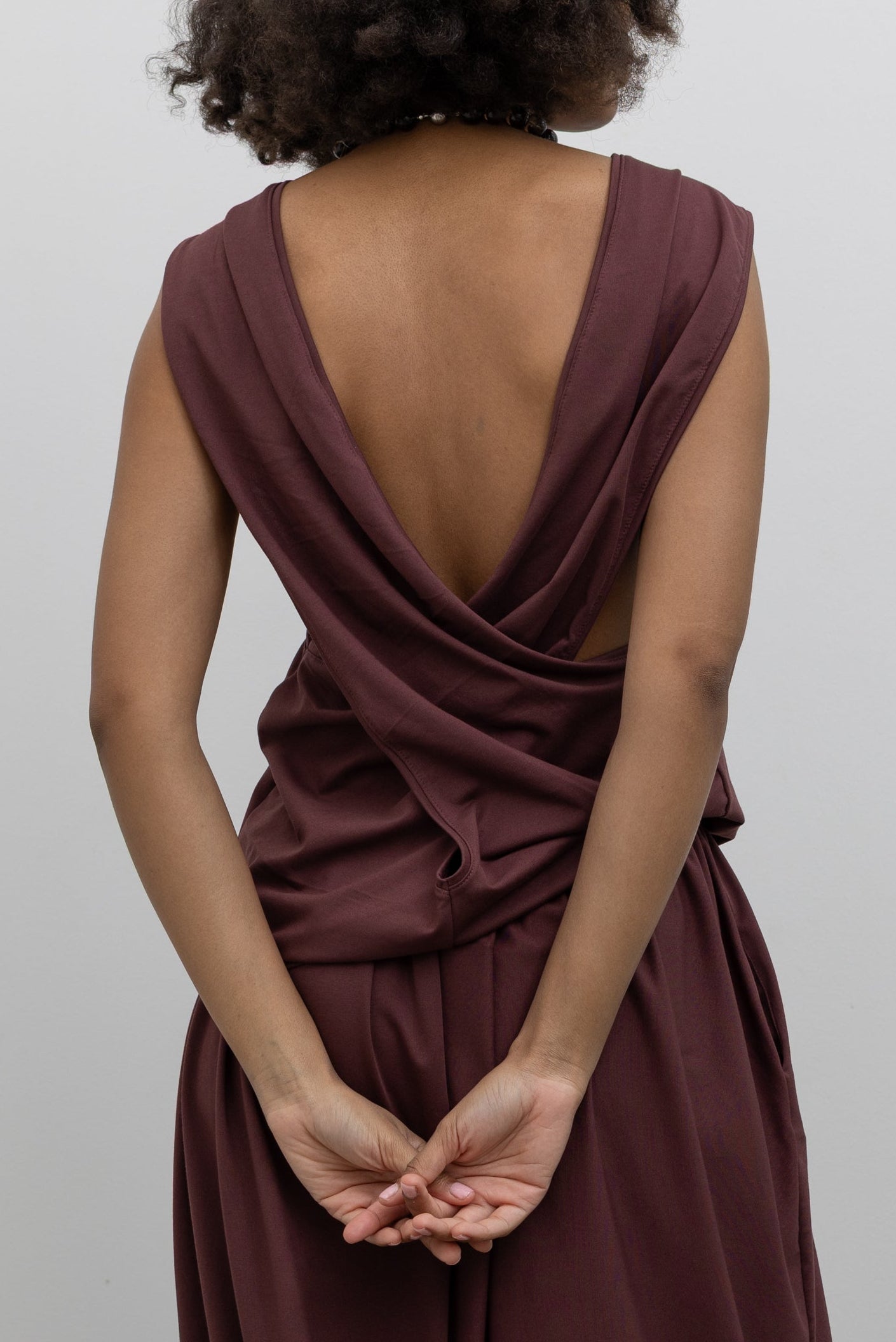 Collective minimalist cotton-blend top with dramatic draped back design at Alas Eius