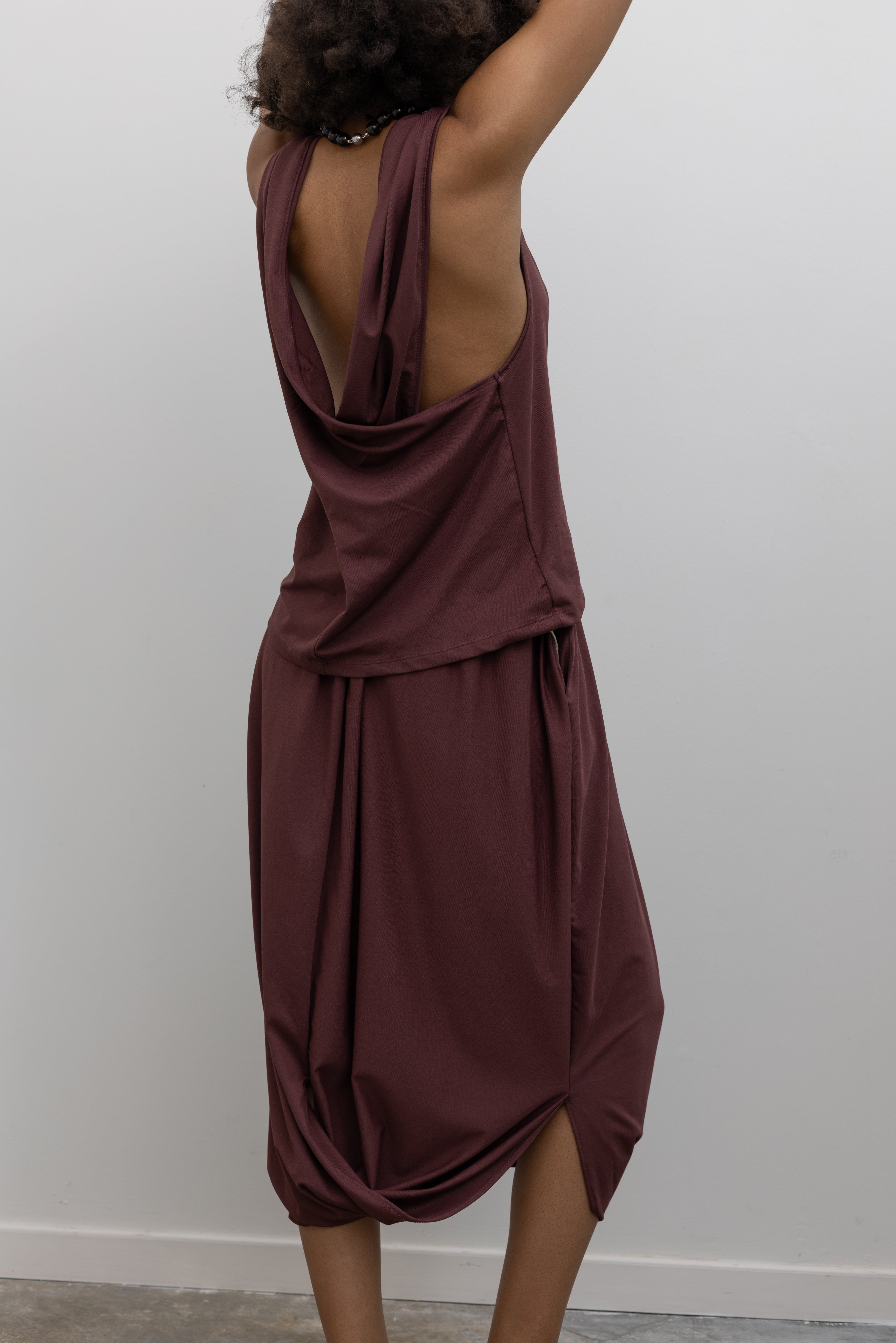 Collective cotton-blend midi skirt with sculptural drape and relaxed silhouette at Alas Eius
