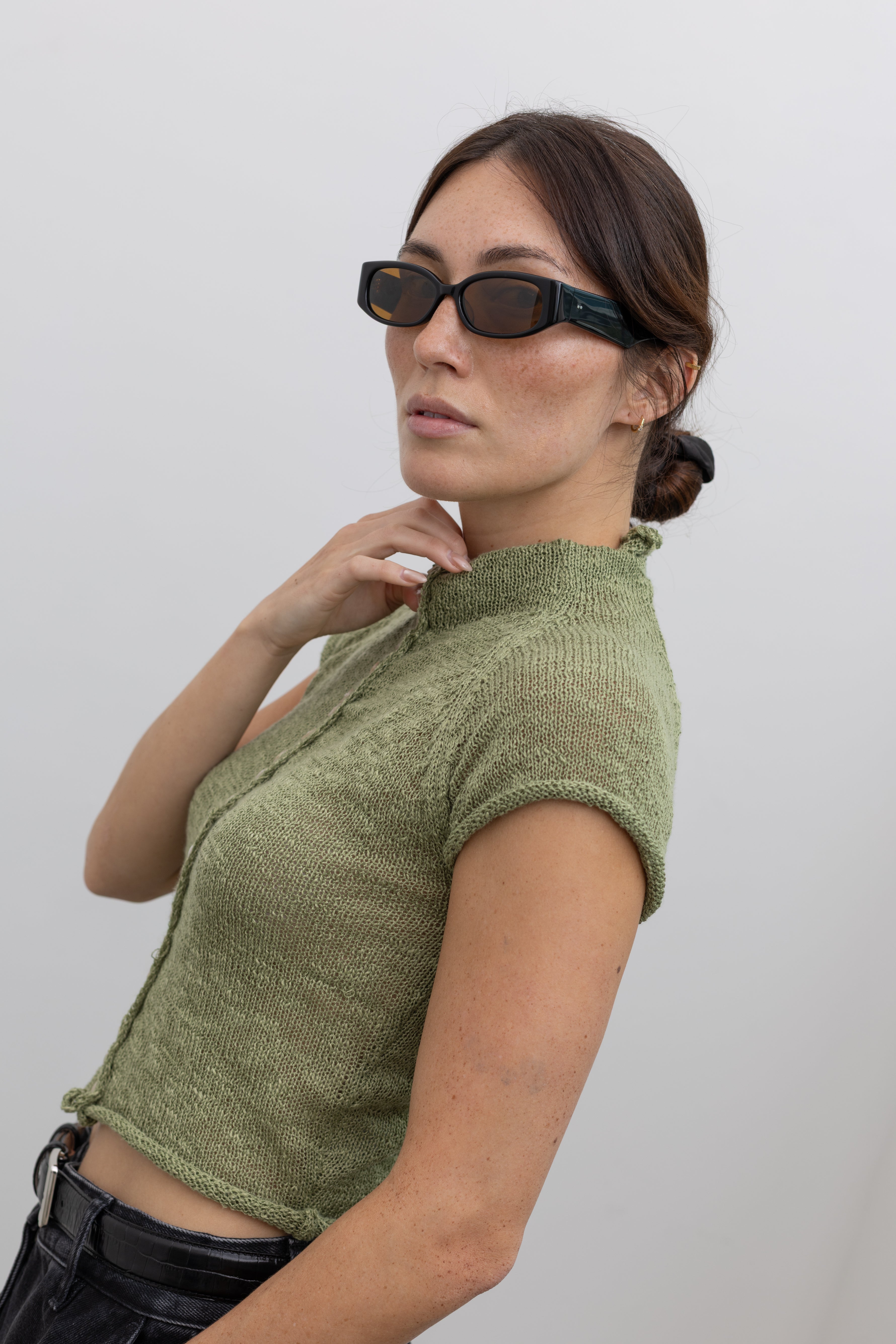 Collective short sleeve semi-sheer knit top with front button detailing at Alas Eius