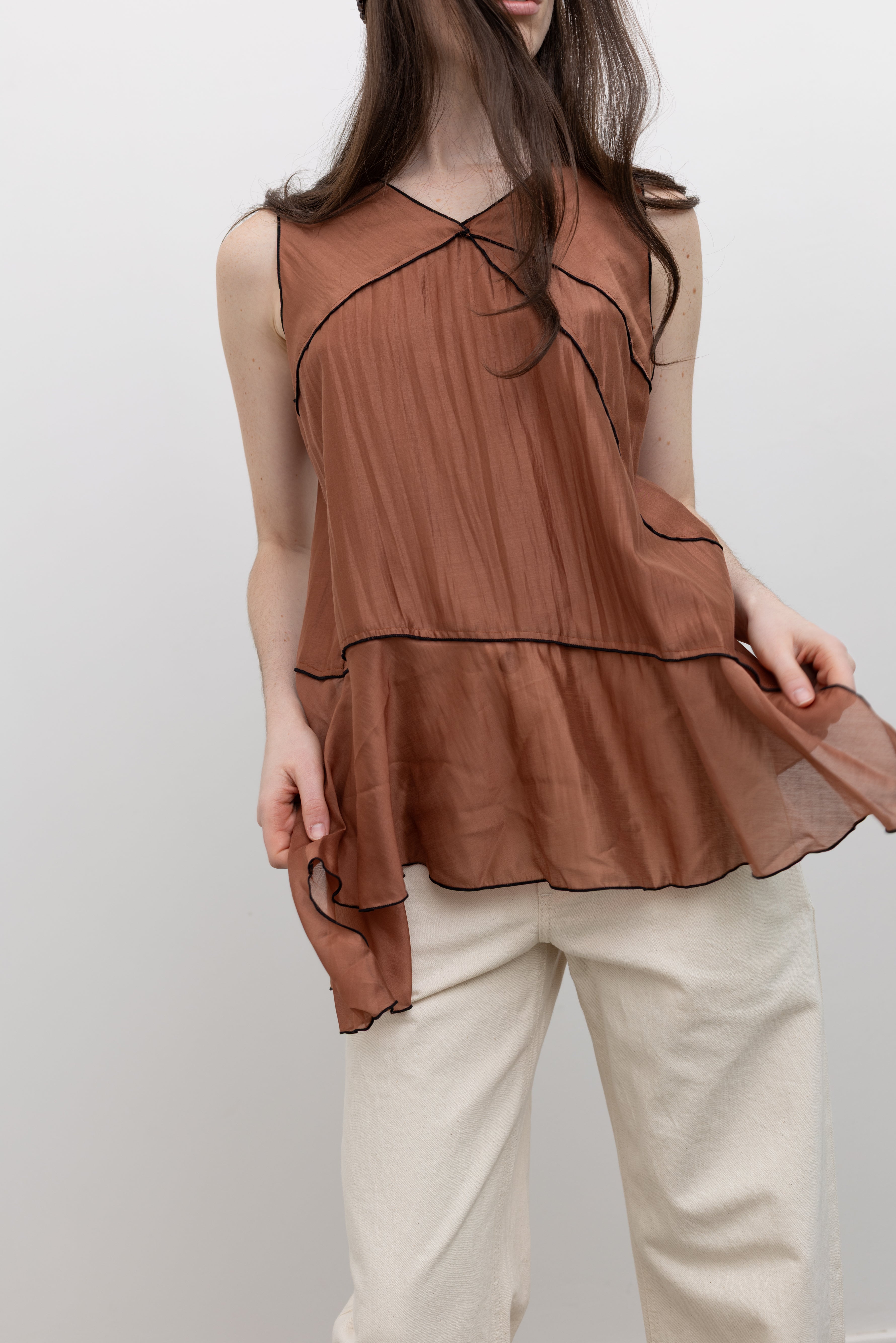 Collective fluid sleeveless blouse designed for elevated women's day-to-night dressing and versatile wardrobe styling at Alas Eius