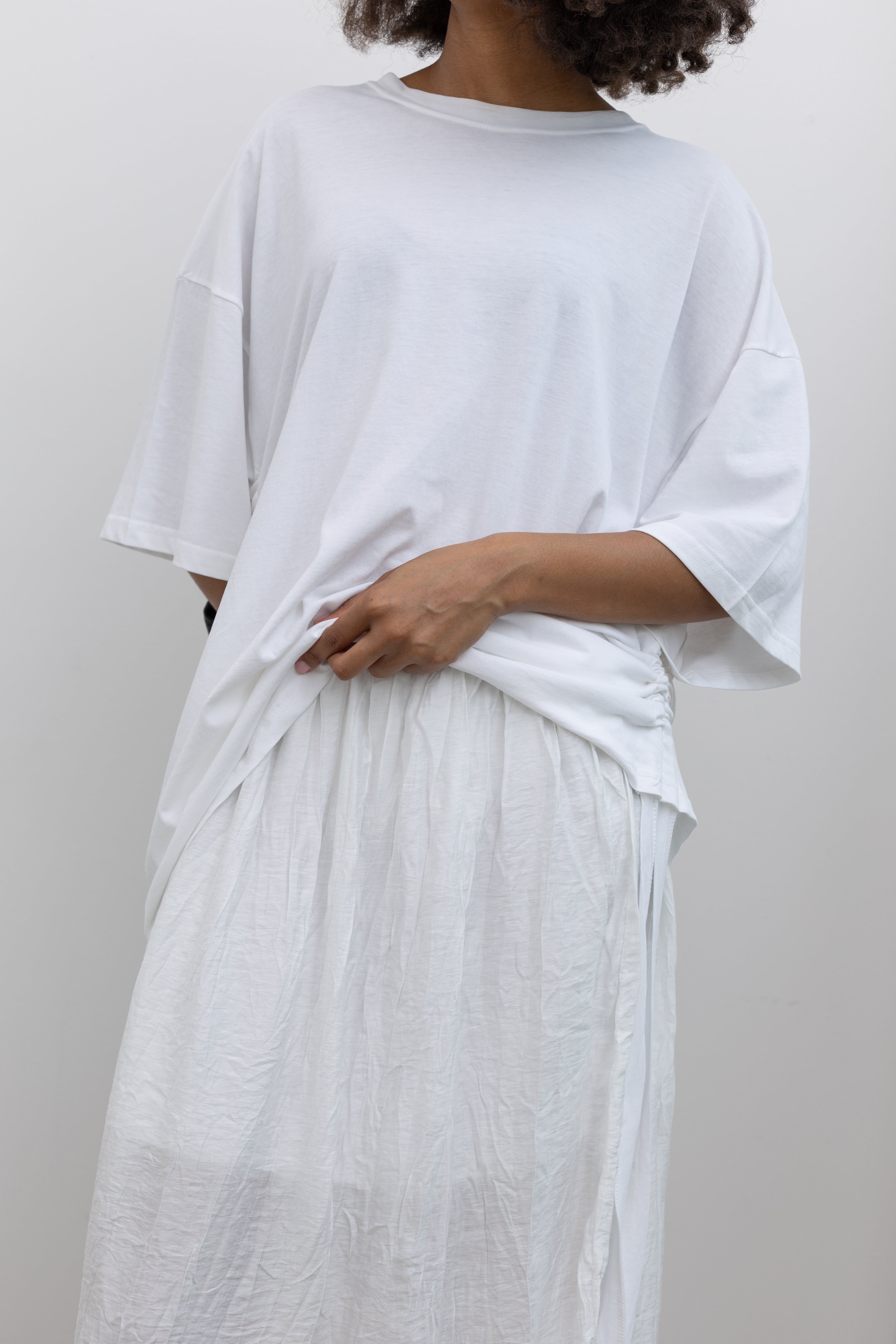 Collective softly gathered cotton blend midi skirt with a naturally wrinkled finish at Alas Eius