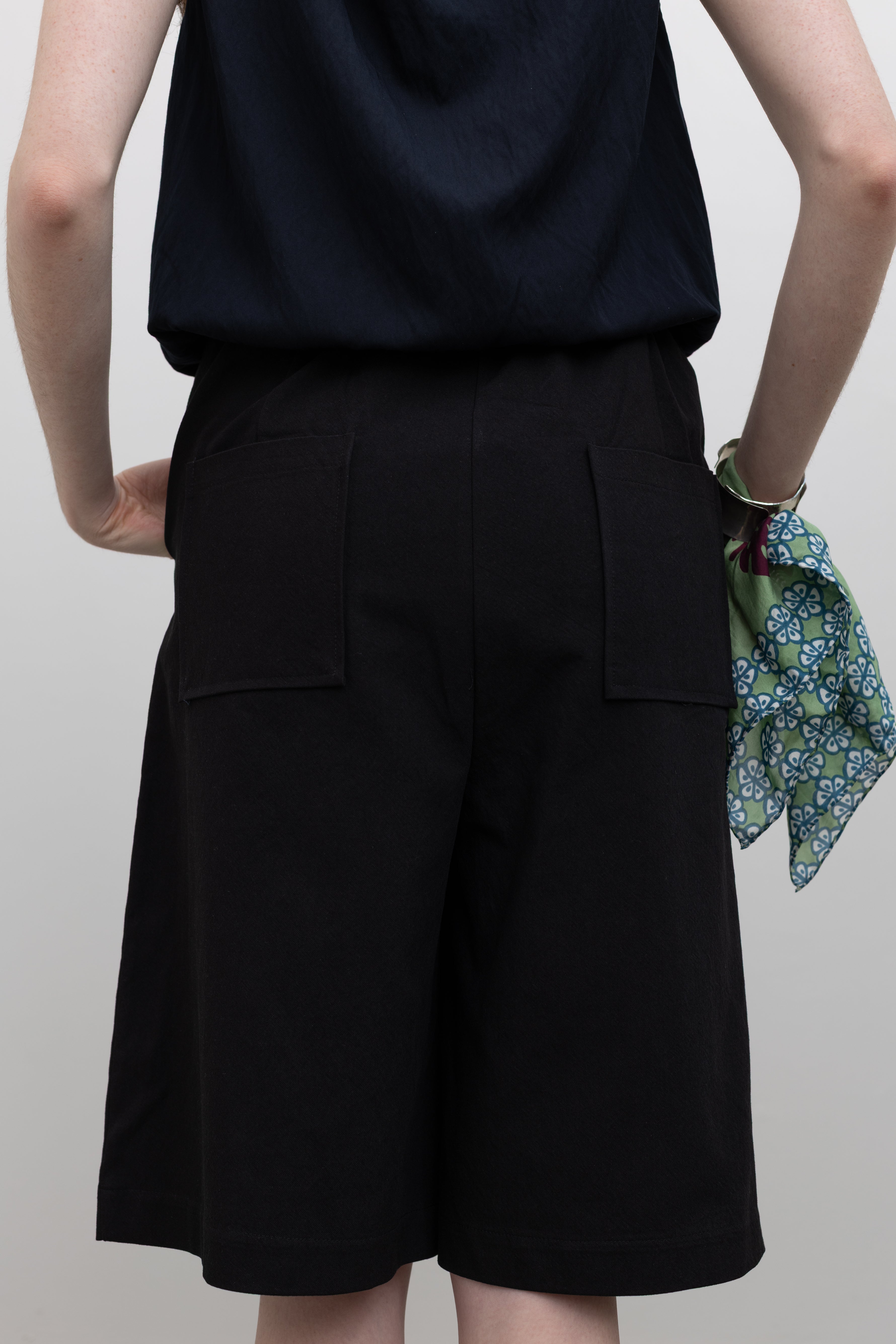 Collective high-waisted bermuda shorts designed with a structured silhouette and comfortable elasticated waistband at Alas Eius.