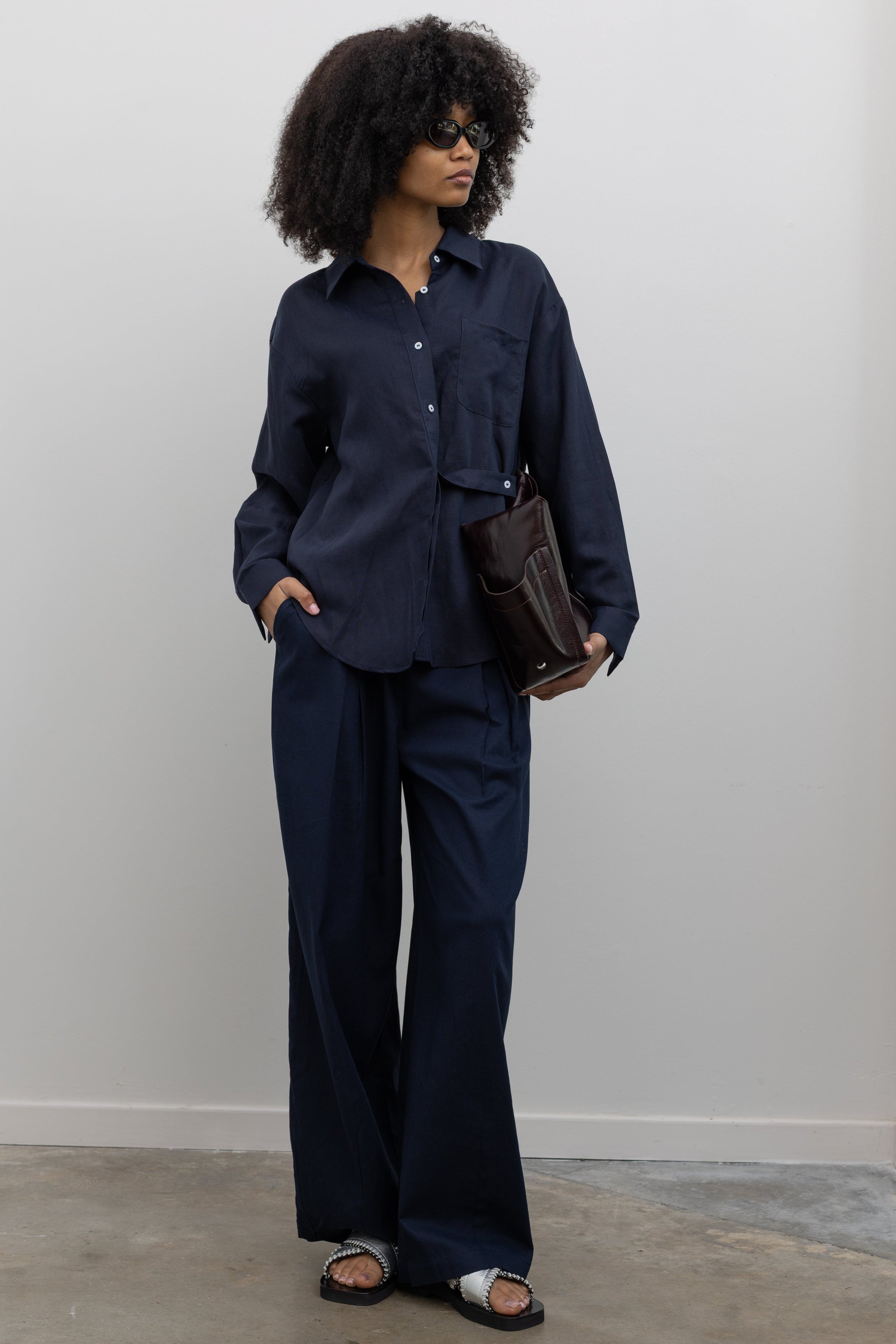 Collective Ink Linen Tuck Pants with relaxed wide-leg silhouette and front pleat details at Alas Eius