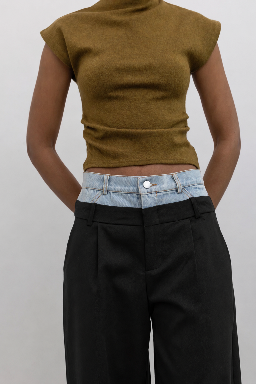 Collective layered denim and trouser pants with a fashion-forward silhouette and contemporary women's clothing style at Alas Eius