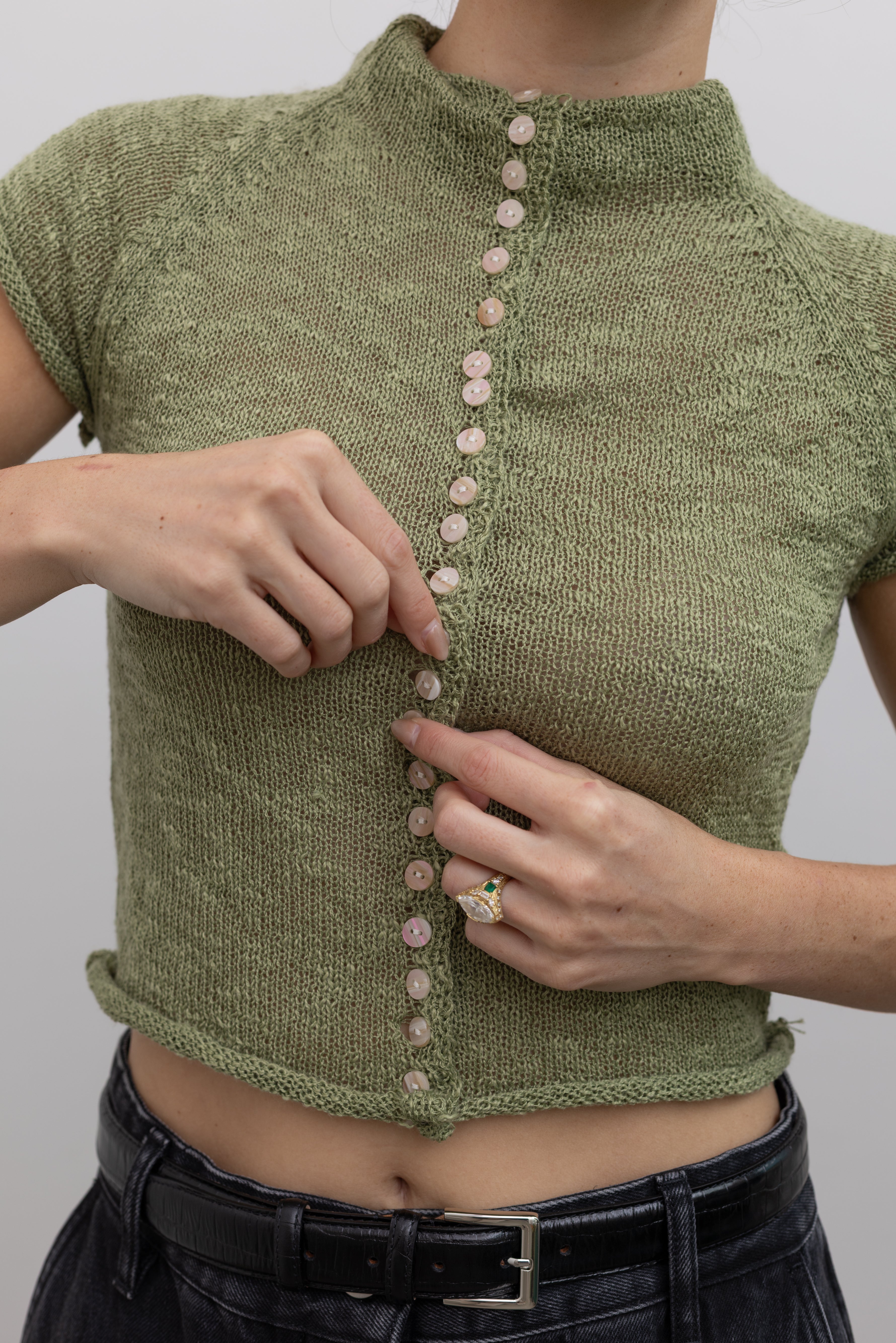 Collective lightweight fitted knit top with a rolled mock neck at Alas Eius