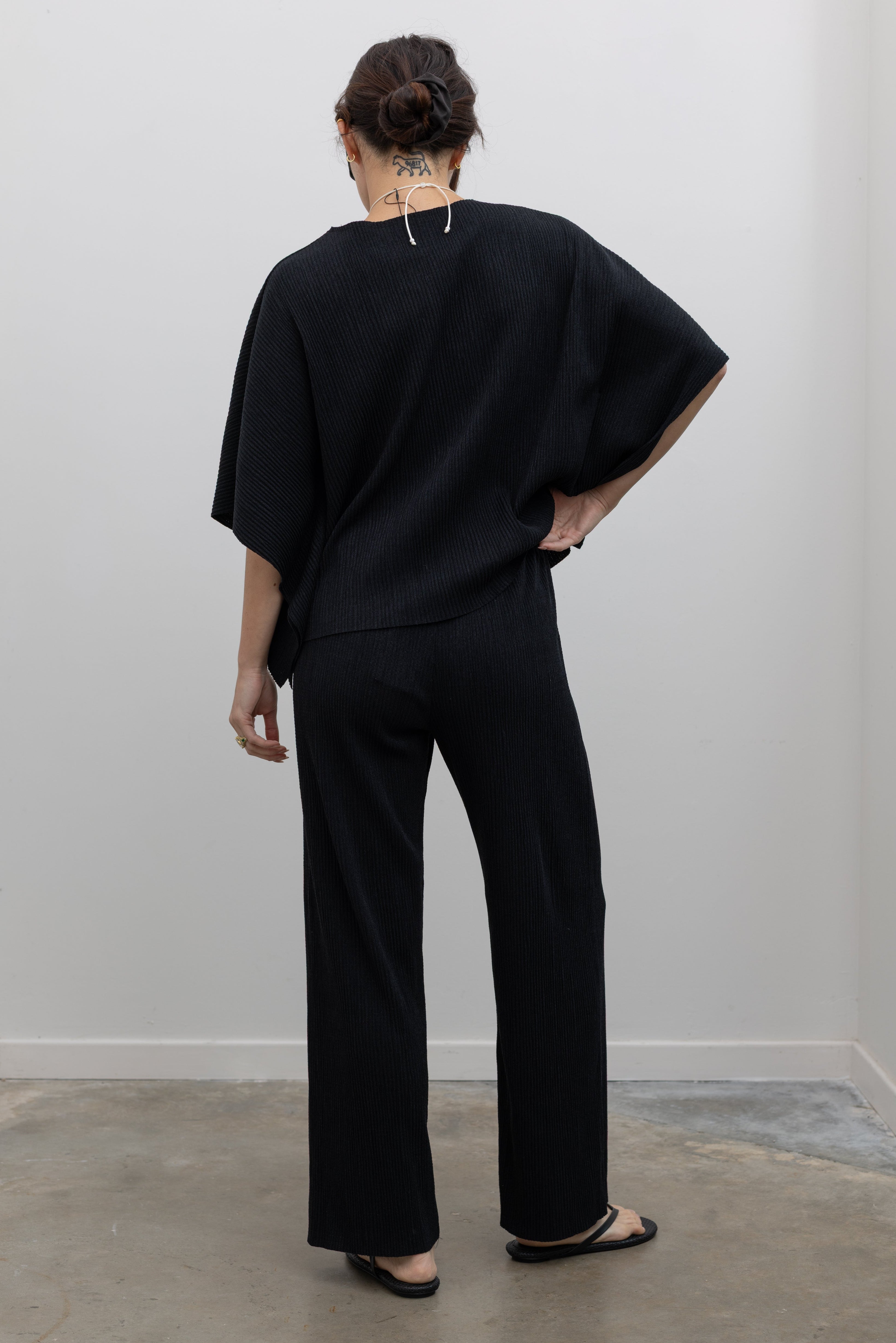 Collective lightweight plissé pleated pants with relaxed fit and elegant movement at Alas Eius