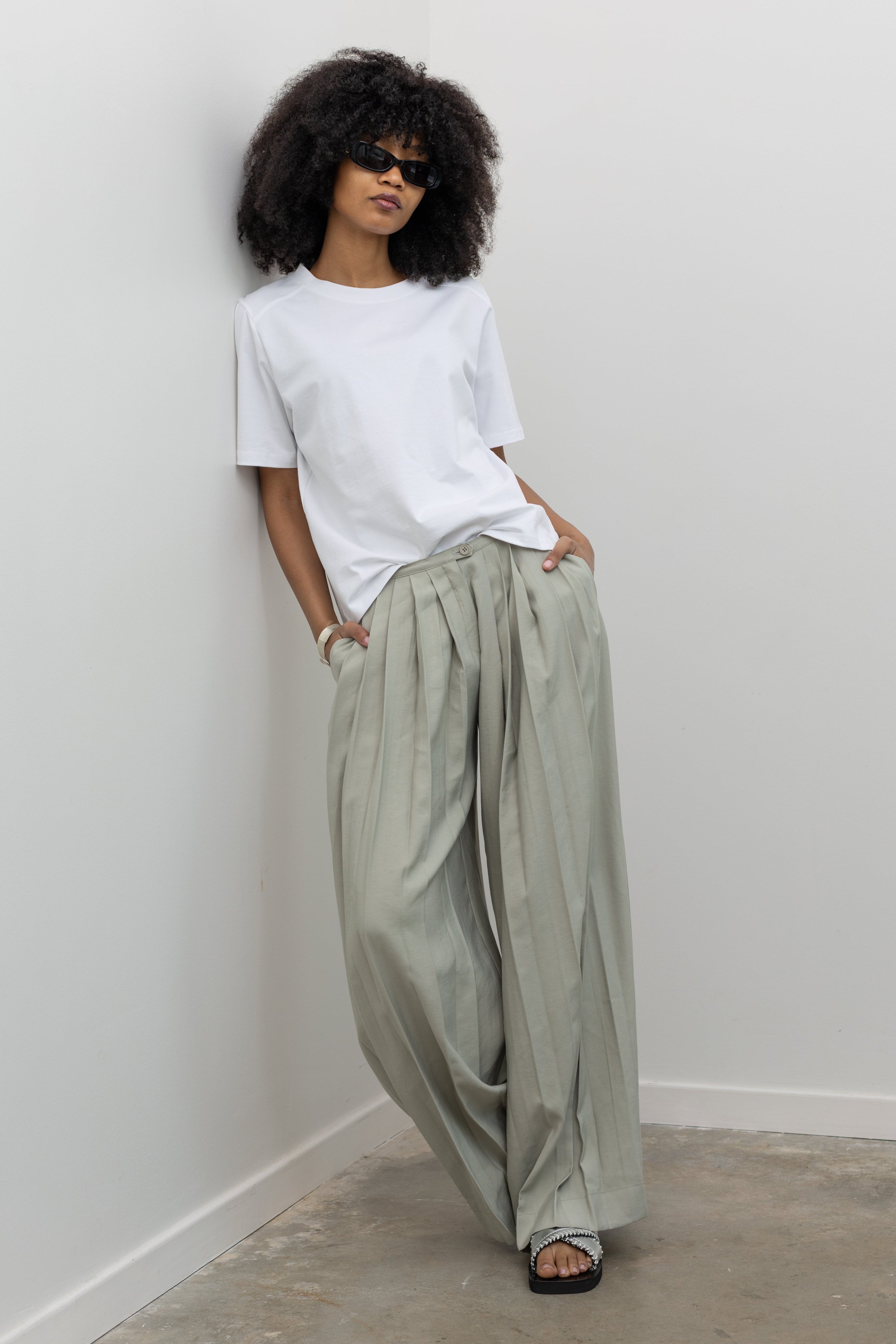 Collective low-rise ultra wide leg bamboo blend trousers with deep front pleats at Alas Eius