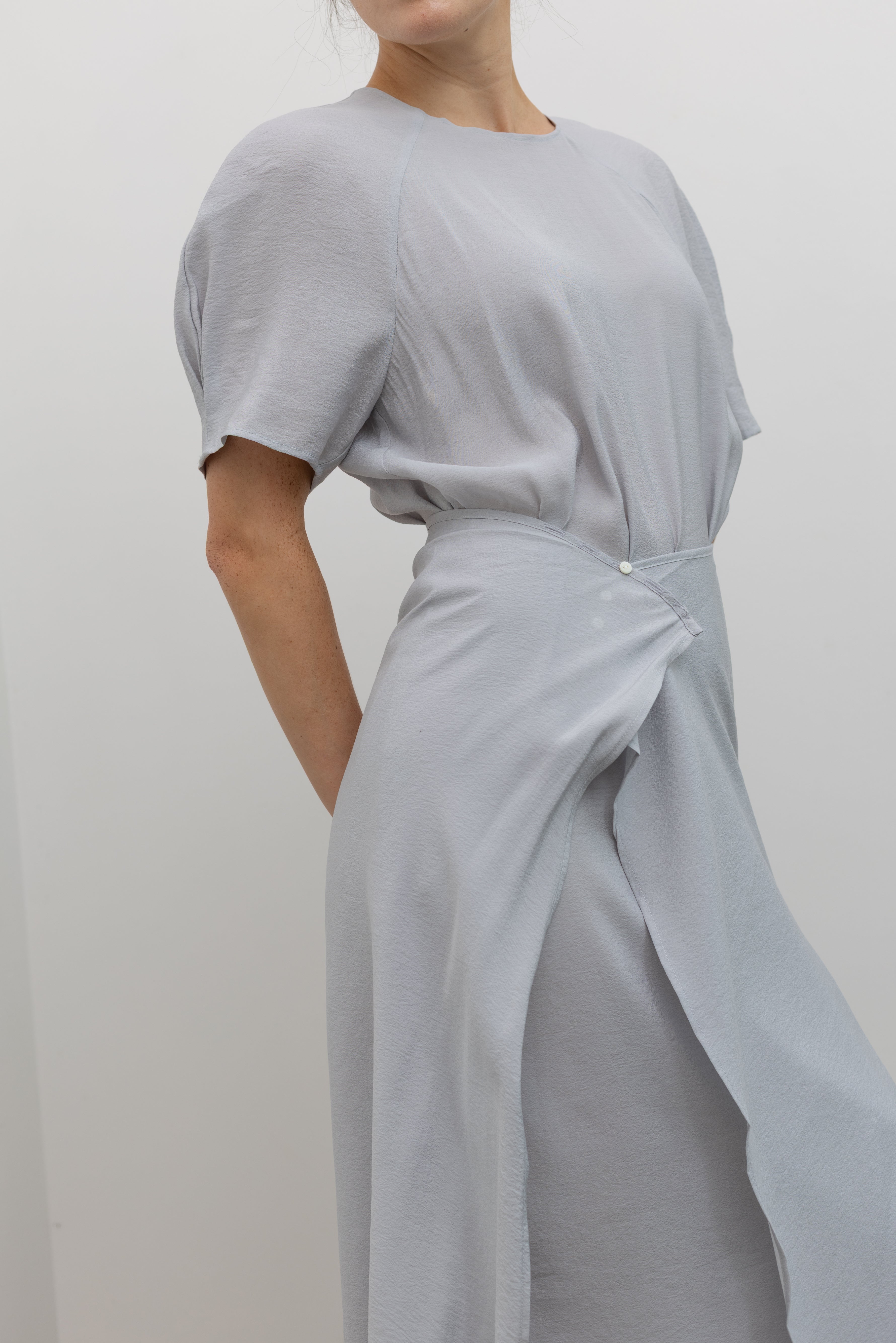 Collective modern midi dress with removable asymmetric skirt and relaxed silhouette at Alas Eius
