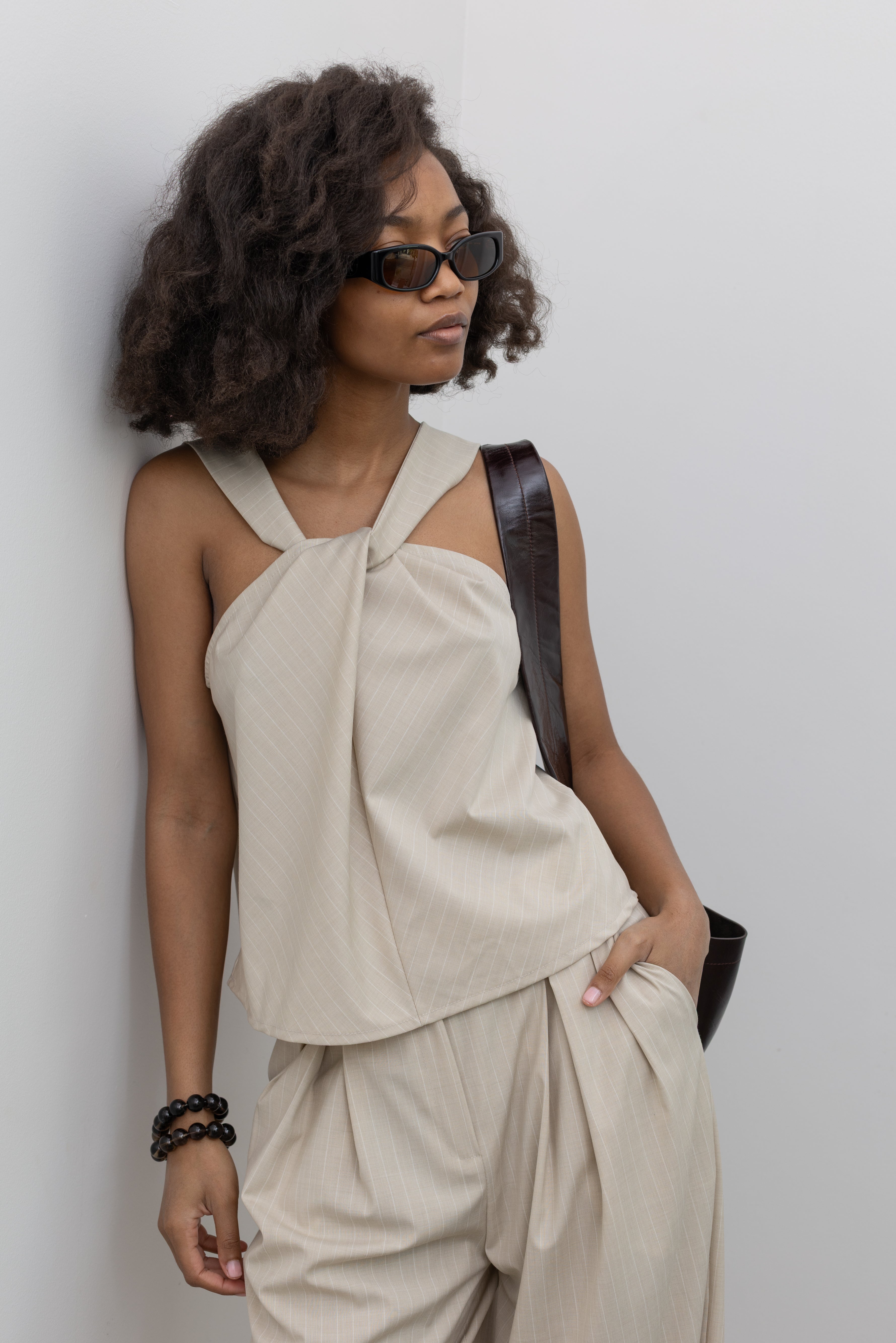 Collective modern pinstripe wide-leg trousers with layered waistband at Alas Eius