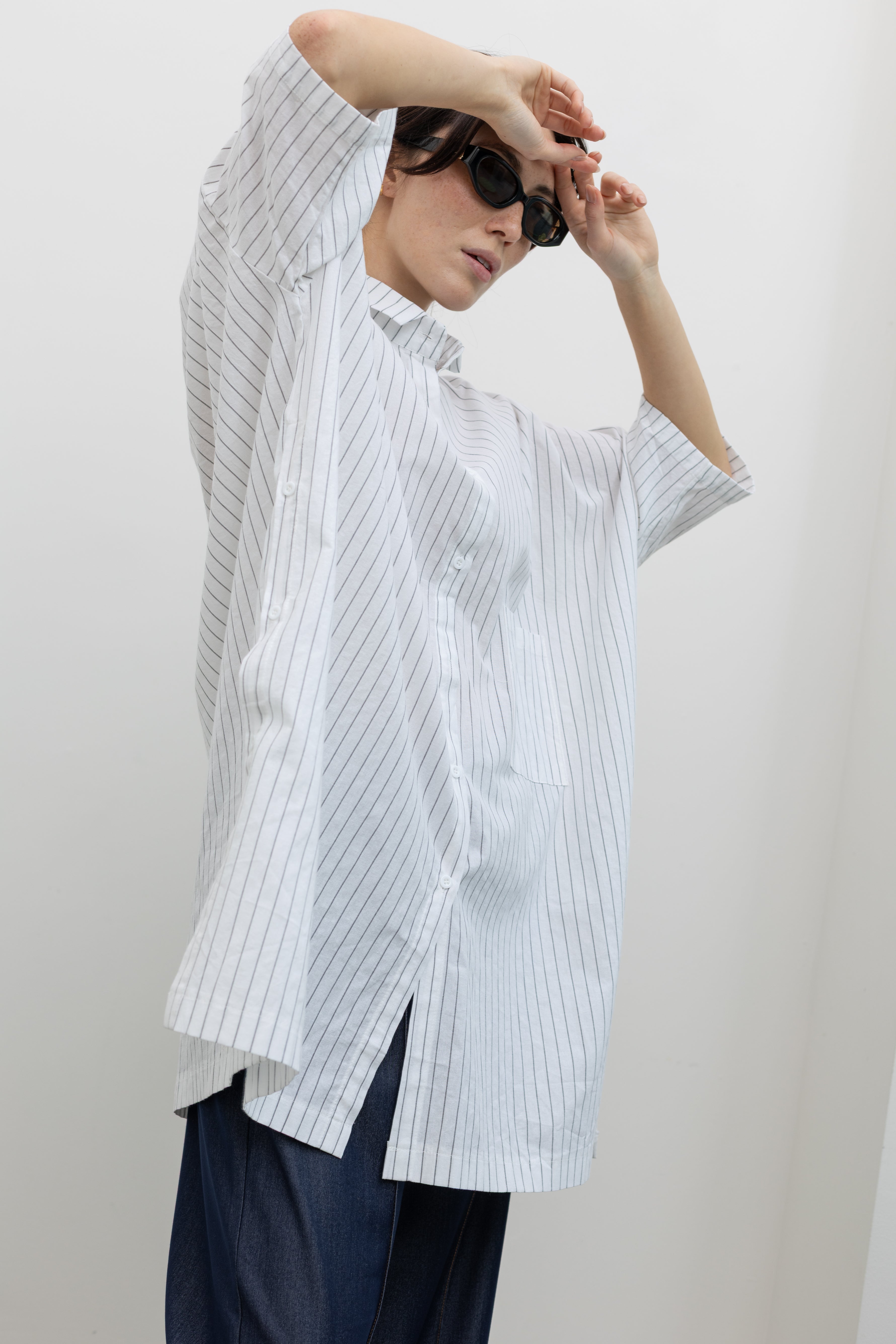 Collective oversized pinstripe tunic with point collar and patch pocket at Alas Eius