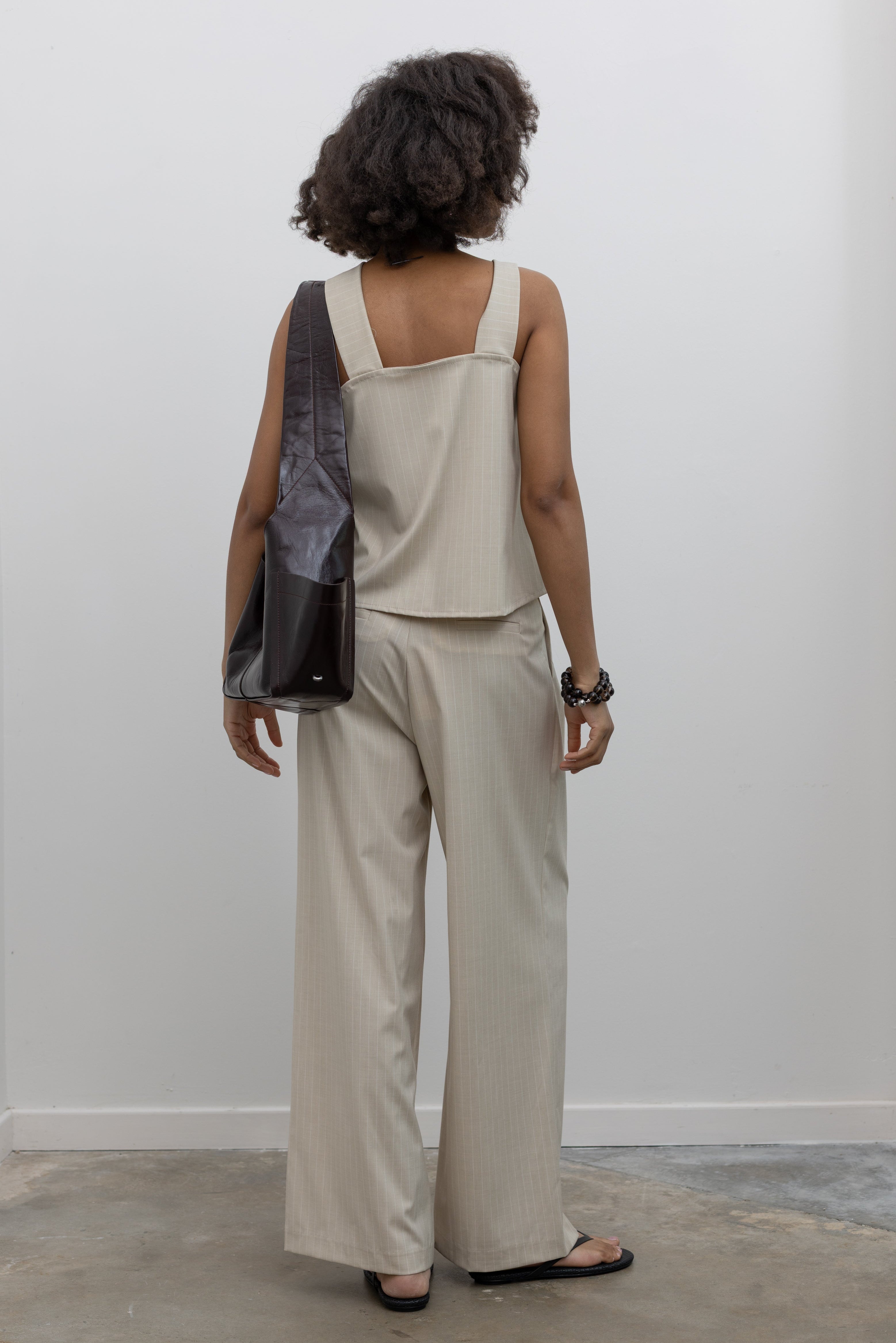 Collective pinstripe drawstring trousers with wide-leg silhouette at Alas Eius