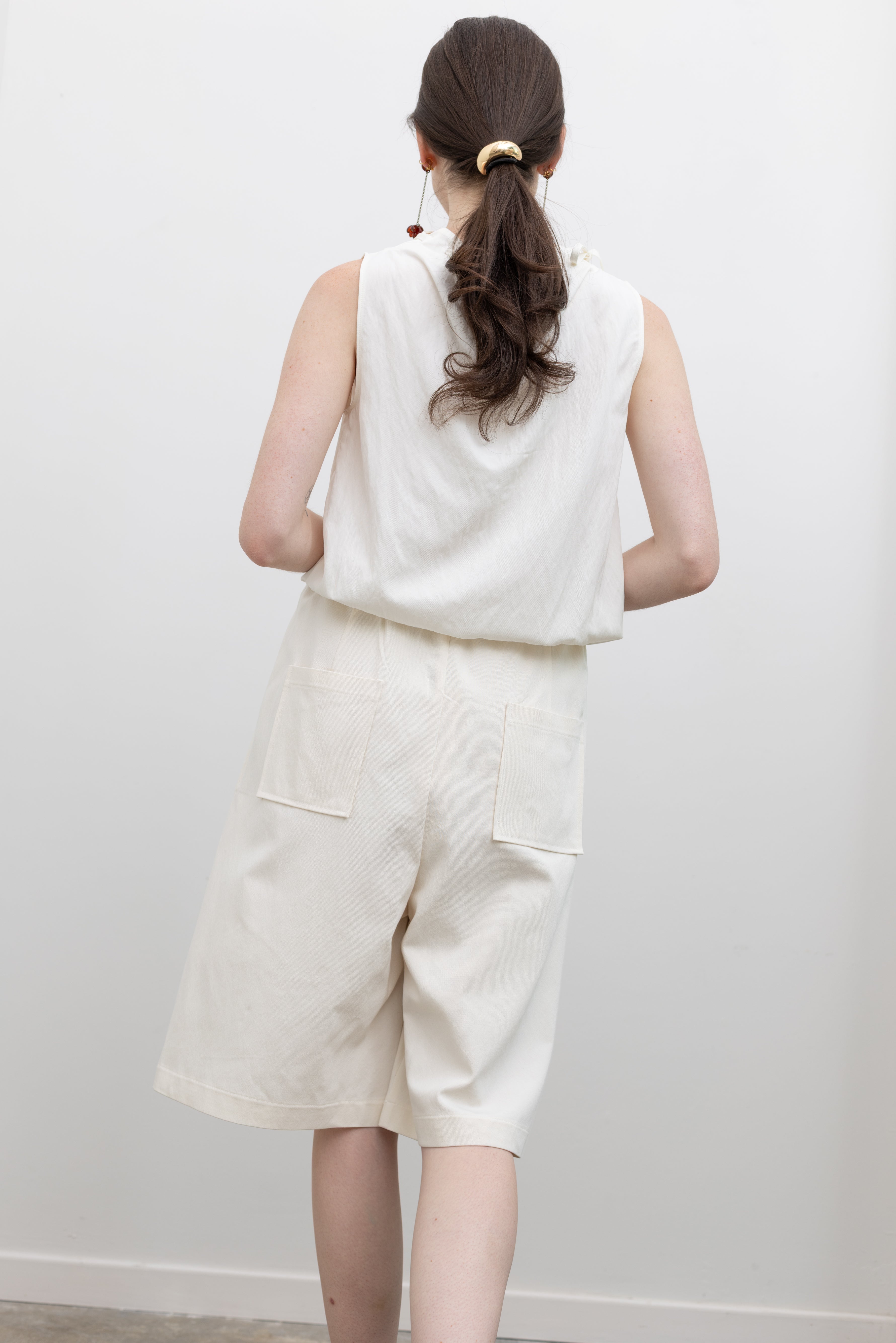 Collective polished bermuda shorts with elasticated back waist and side pockets, designed for women's smart casual outfit styling at Alas Eius