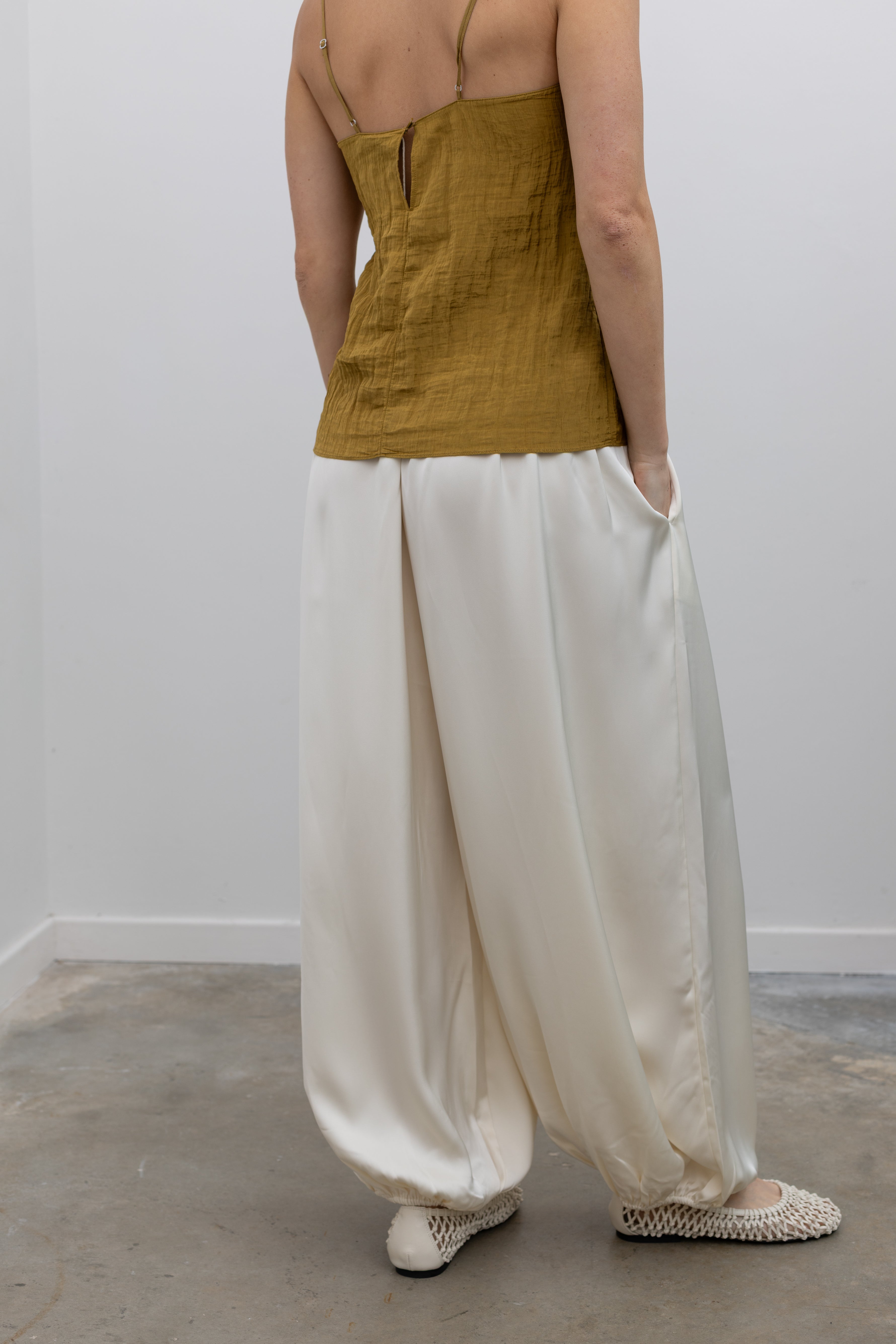 Collective relaxed balloon pants with fluid drape and modern minimalist shape at Alas Eius