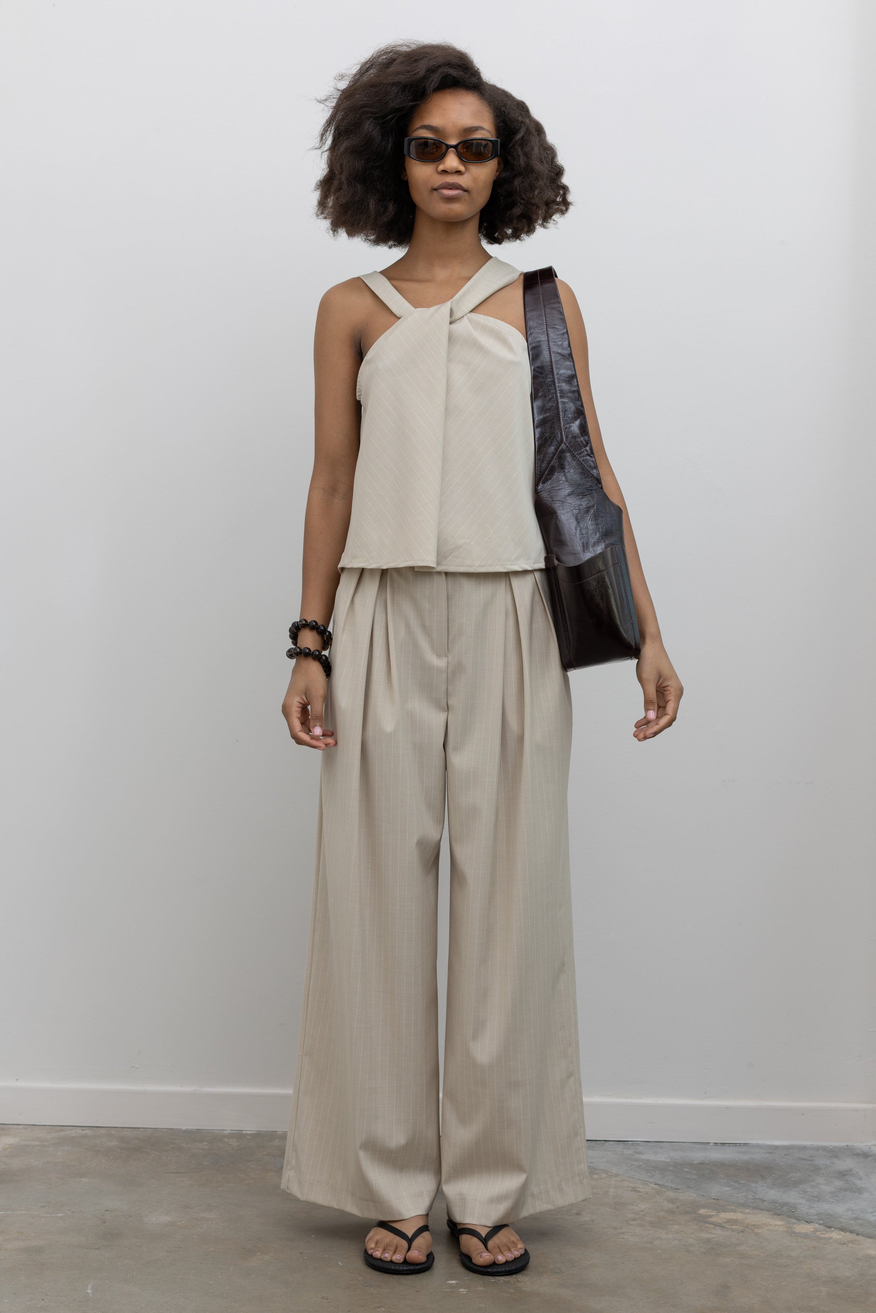 Collective relaxed pinstripe trousers with elastic waistband and drawstring at Alas Eius